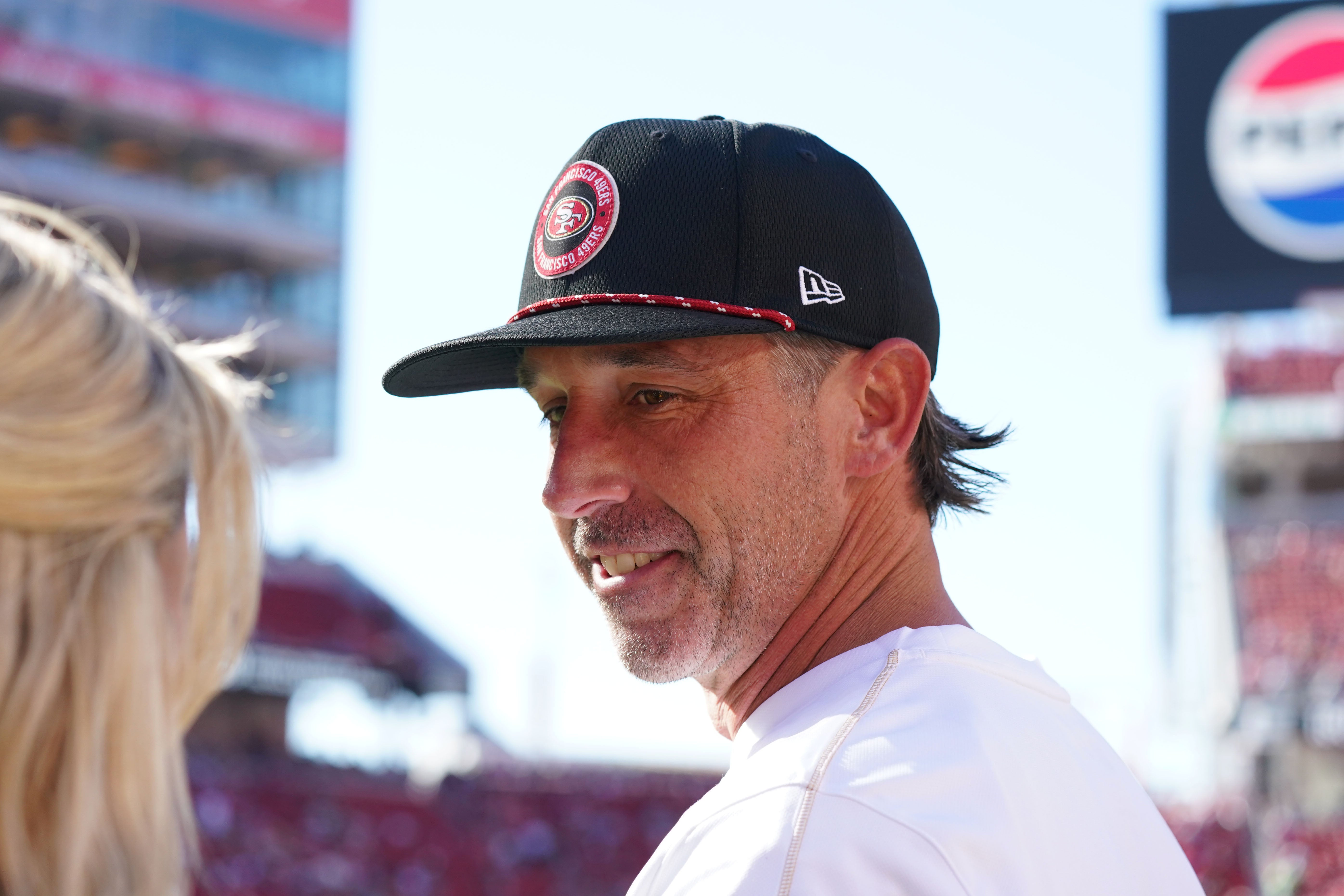 Sep 9, 2024; Santa Clara, California, USA; San Francisco 49ers head coach Kyle Shanahan chats with a reporter before a game against the New York Jets at Levi's Stadium.