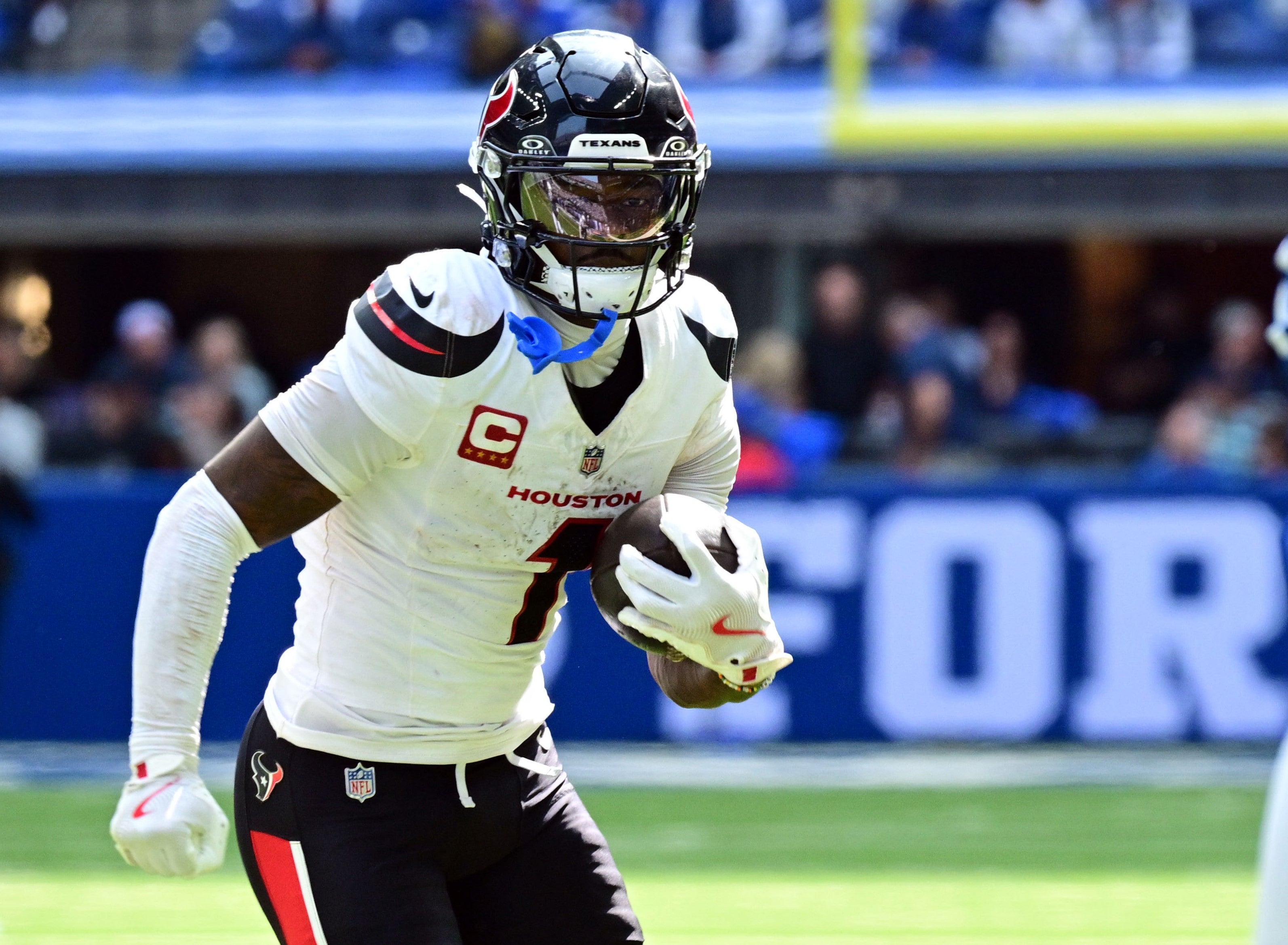 Stefon Diggs (1) runs the ball in front of cornerback Jaylon Jones (40) during the second half at Lucas Oil Stadium.
