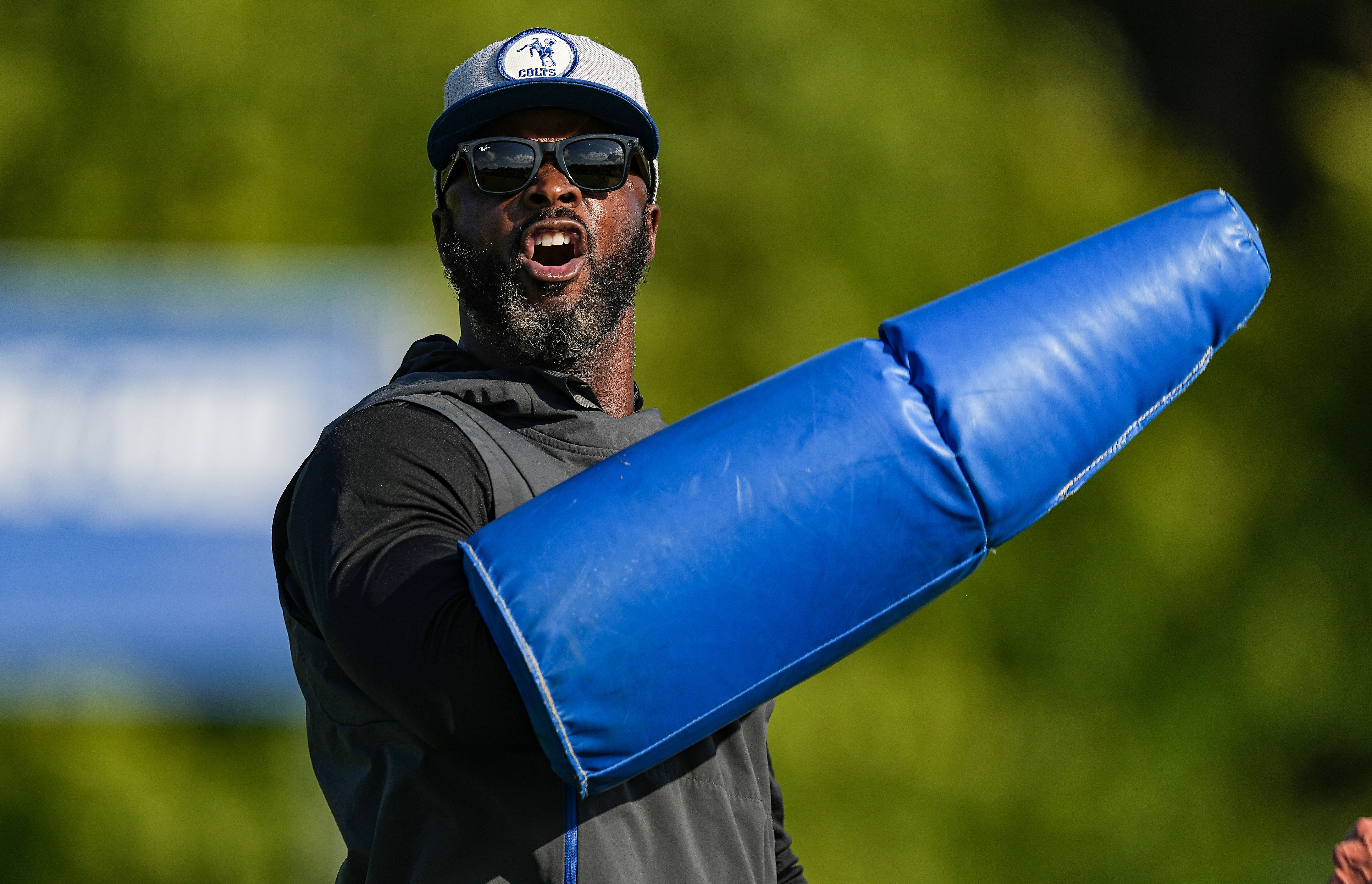 Indianapolis Colts wide receiver coach Reggie Wayne yells while helping with drills Thursday, Aug. 17, 2023, during training camp at Grand Park Sports Campus in Westfield.