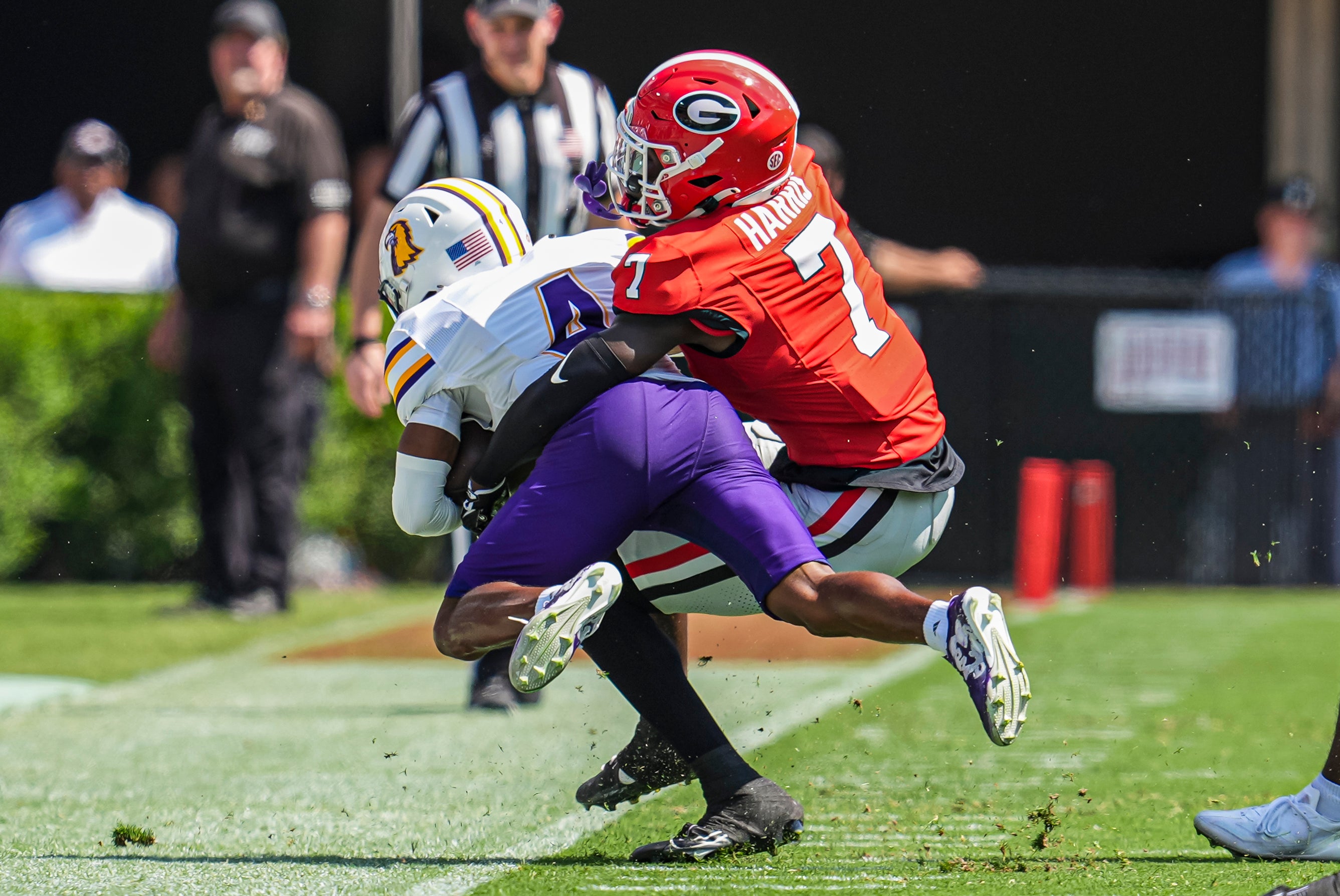 Georgia Bulldogs defensive back Daniel Harris (7) tackles Tennessee Tech Golden Eagles wide receiver Jay Parker (4) during the first half at Sanford Stadium.