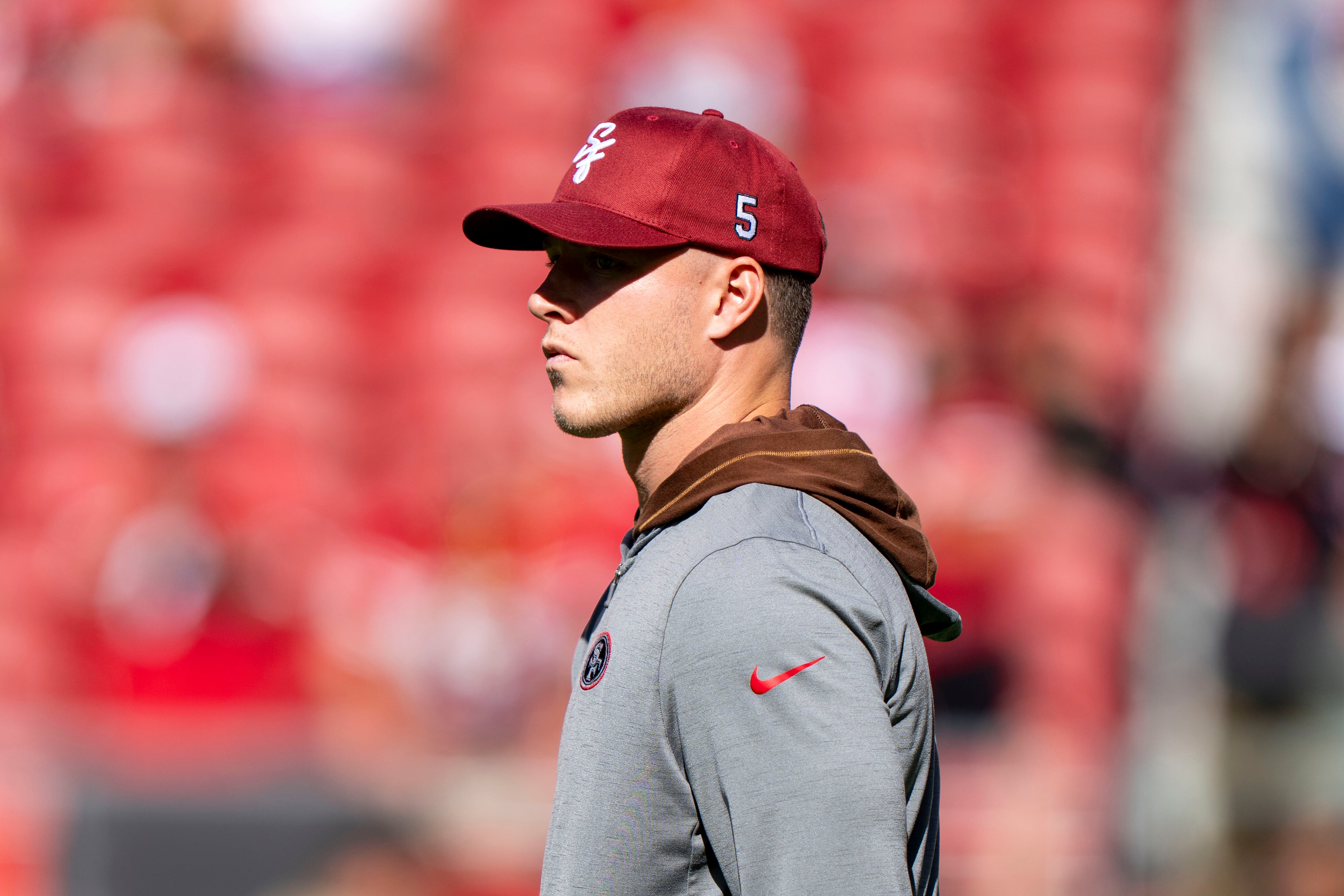 August 18, 2024; Santa Clara, California, USA; San Francisco 49ers running back Christian McCaffrey (23) watches warm ups before the game against the New Orleans Saints at Levi's Stadium.