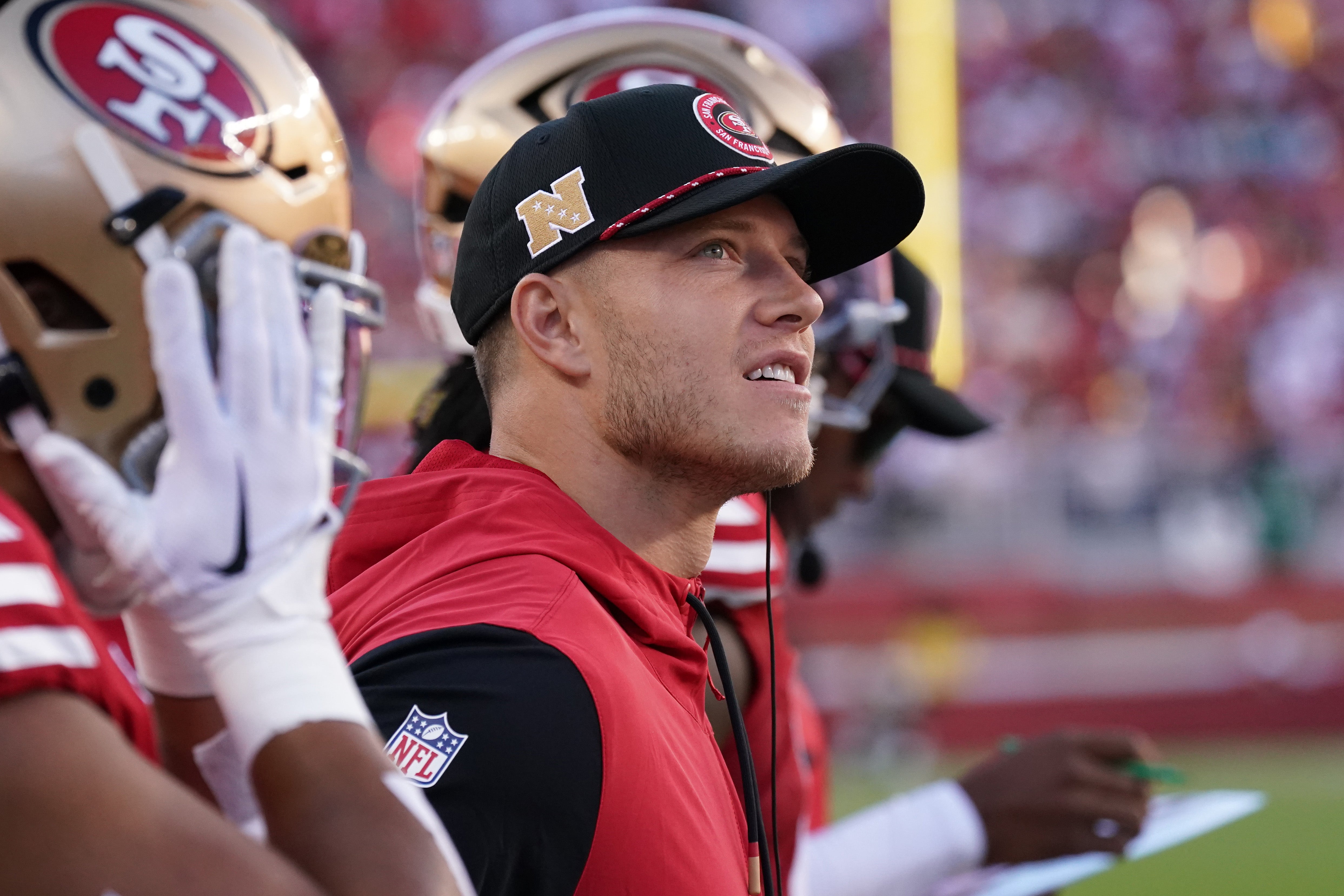 Sep 9, 2024; Santa Clara, California, USA; San Francisco 49ers running back Christian McCaffrey (23) watches injured from the sidelines in the second quarter against the New York Jets at Levi's Stadium.
