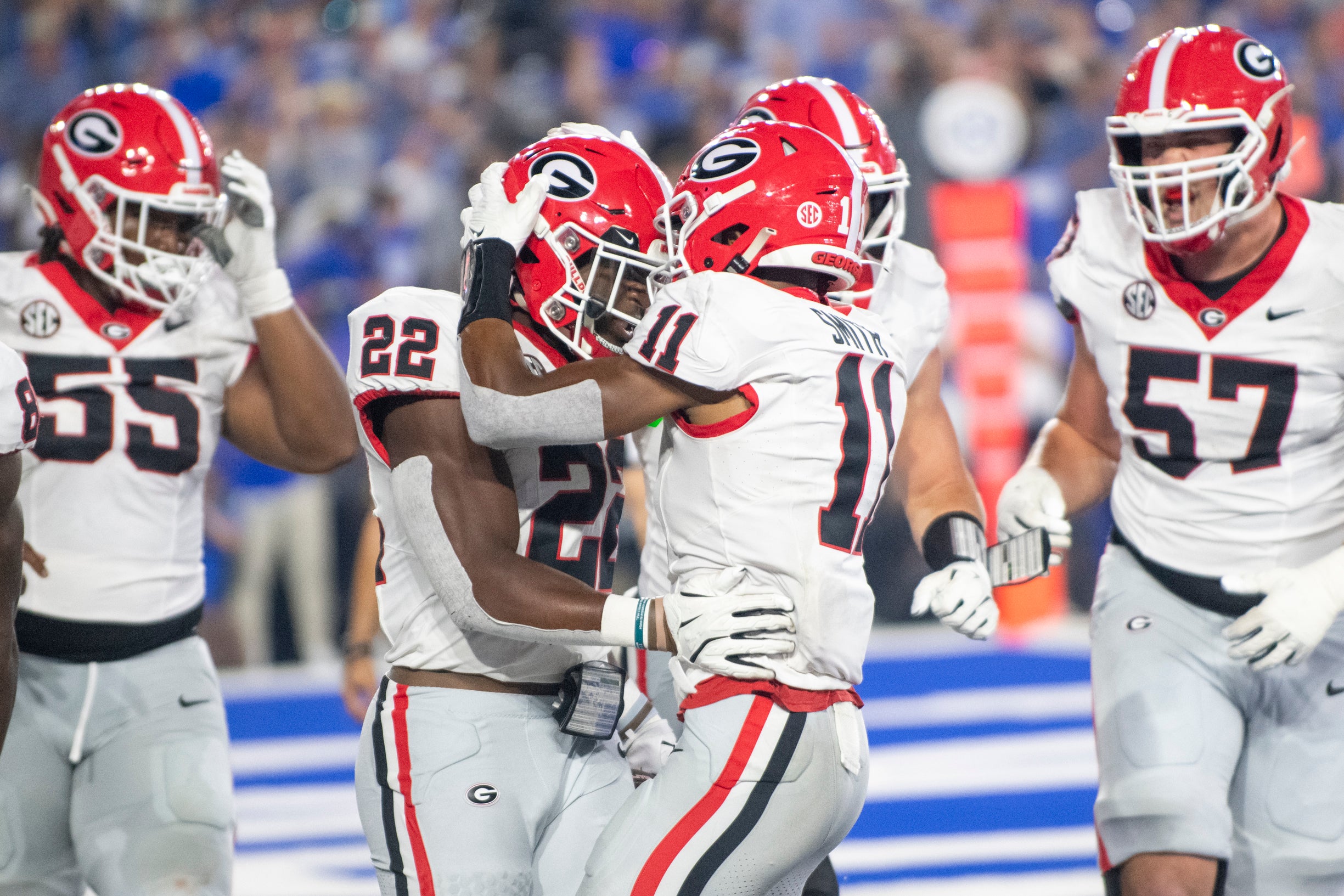 Georgia Bulldogs running back Branson Robinson (22) celebrates with wide receiver Arian Smith (11) after a touchdown in the fourth quarter against the Kentucky Wildcats at Kroger Field.