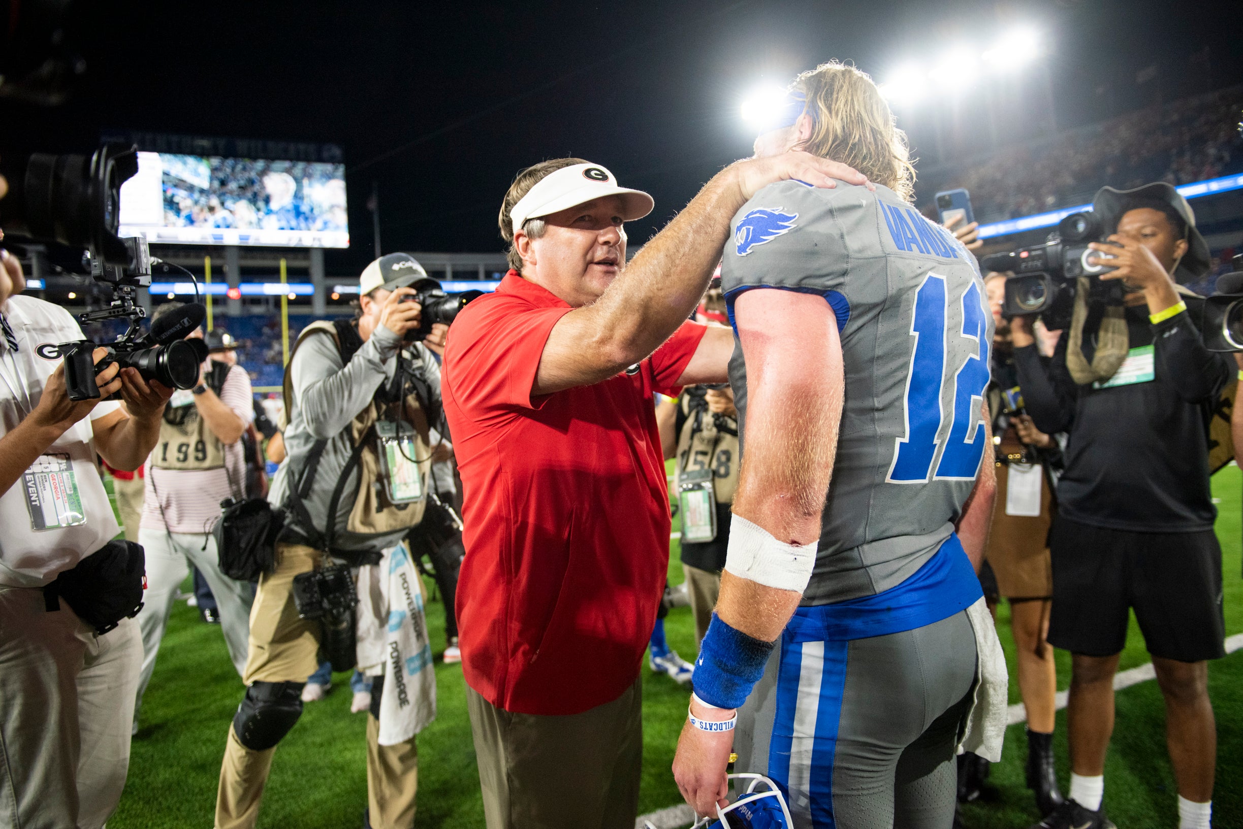 Georgia Bulldogs head coach Kirby Smart talks to Kentucky Wildcats quarterback Brock Vandagriff (12) after the game at Kroger Field.