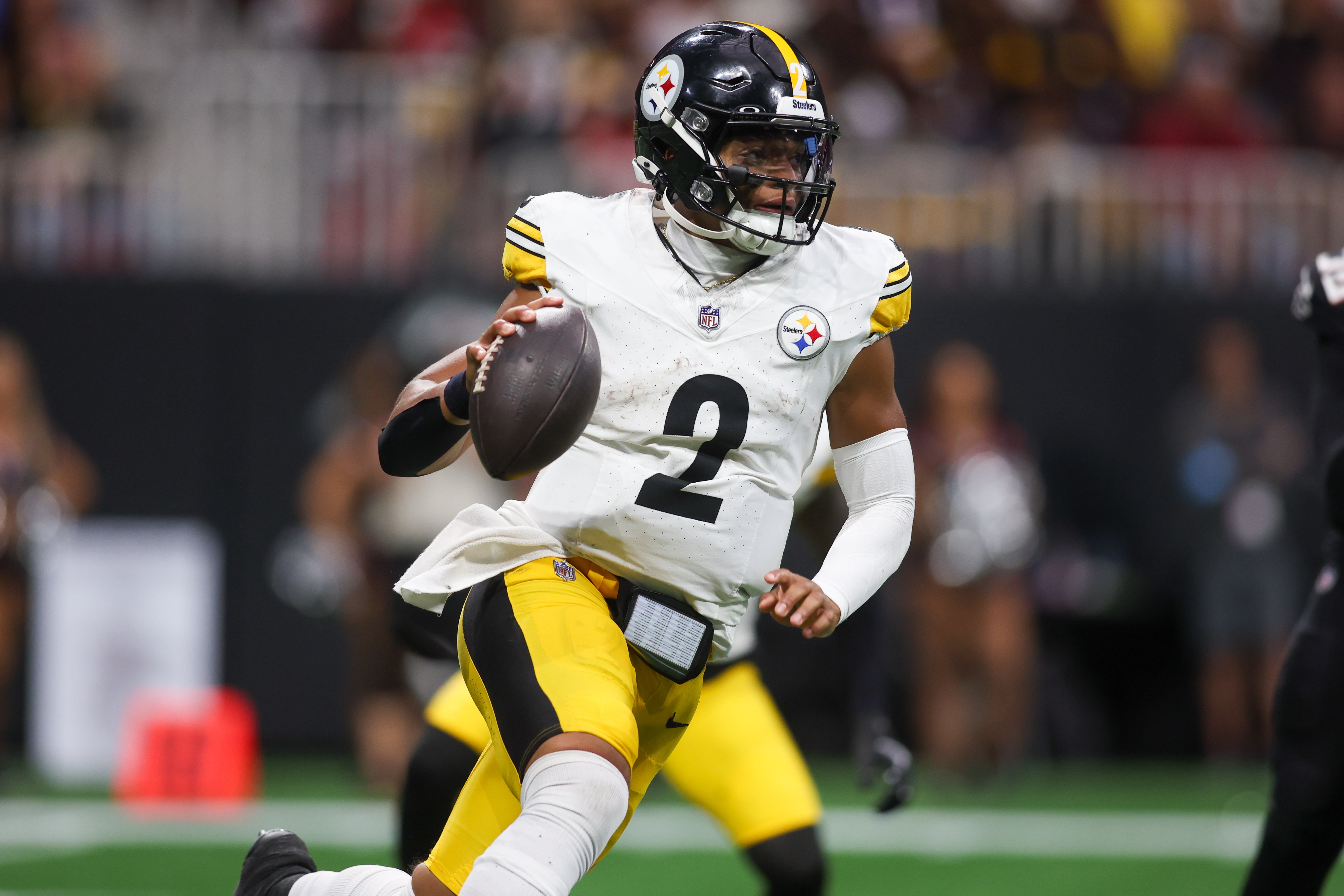 Sep 8, 2024; Atlanta, Georgia, USA; Pittsburgh Steelers quarterback Justin Fields (2) scrambles against the Atlanta Falcons in the fourth quarter at Mercedes-Benz Stadium. Mandatory Credit: Brett Davis-Imagn Images