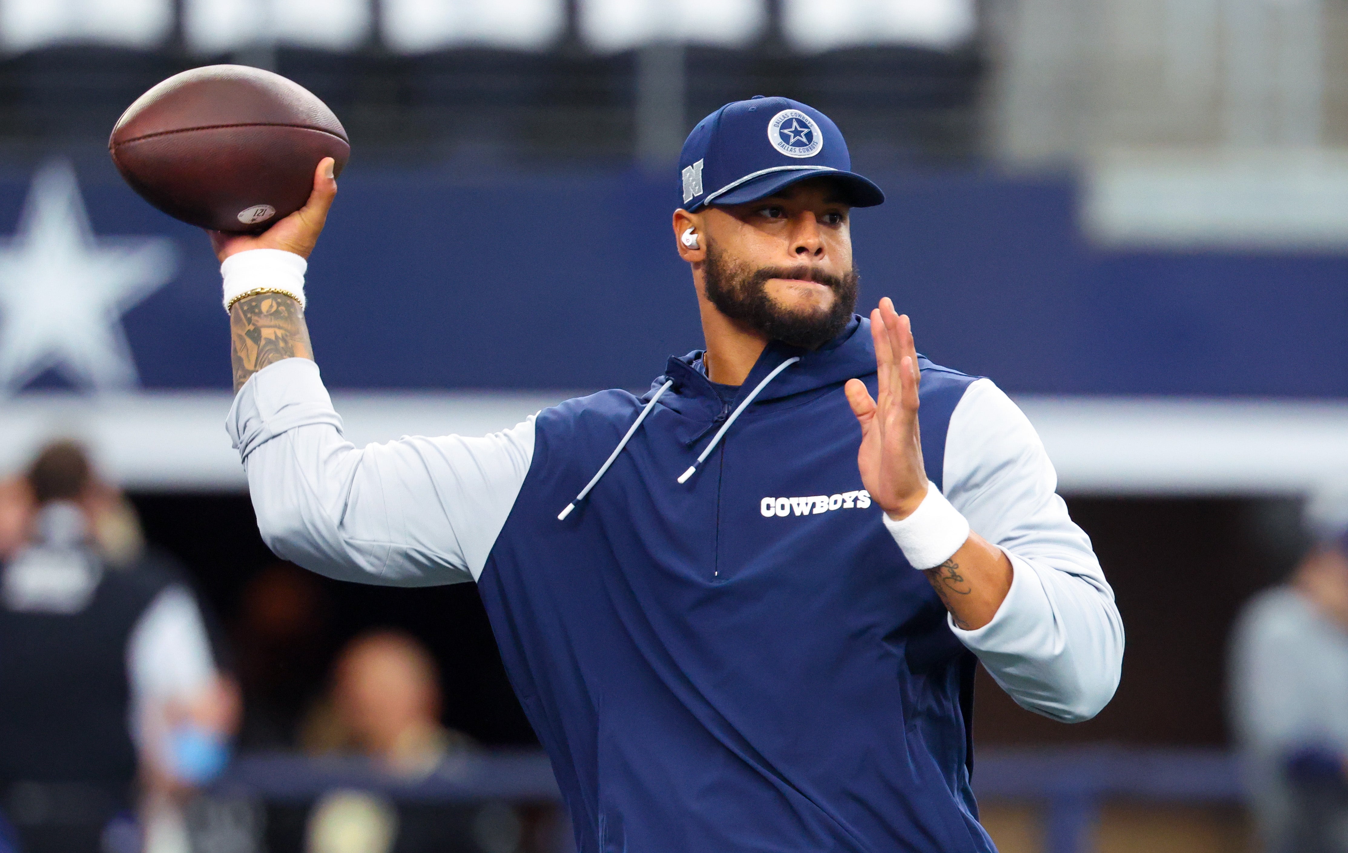 Dallas Cowboys quarterback Dak Prescott (4) warms up before the game against the New Orleans Saints at AT&T Stadium.