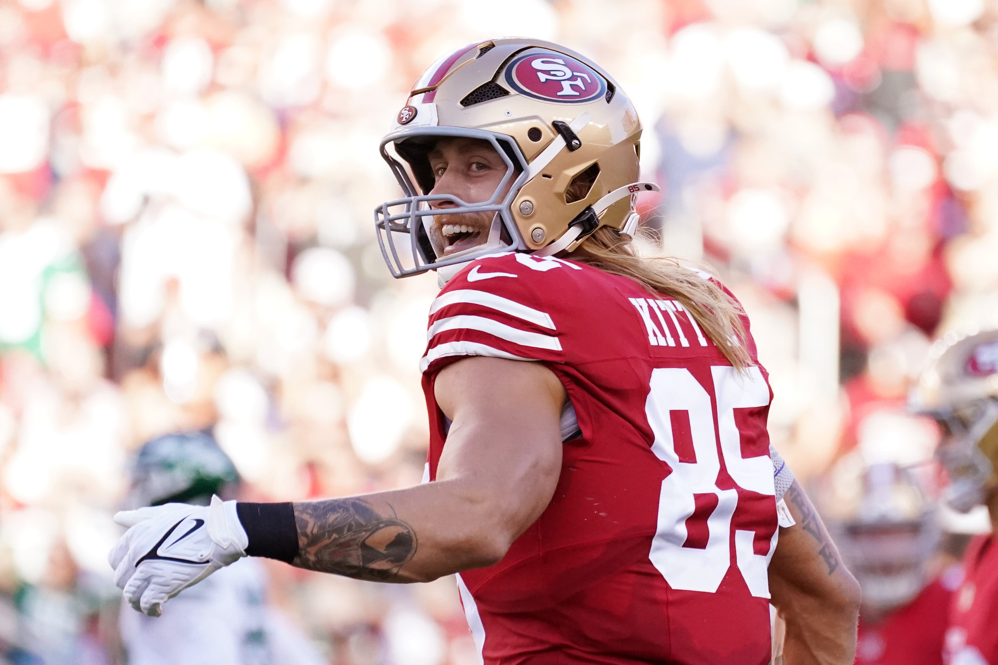 Sep 9, 2024; Santa Clara, California, USA; San Francisco 49ers tight end George Kittle (85) smiles at the referee in the first quarter vs. the New York Jets at Levi's Stadium.
