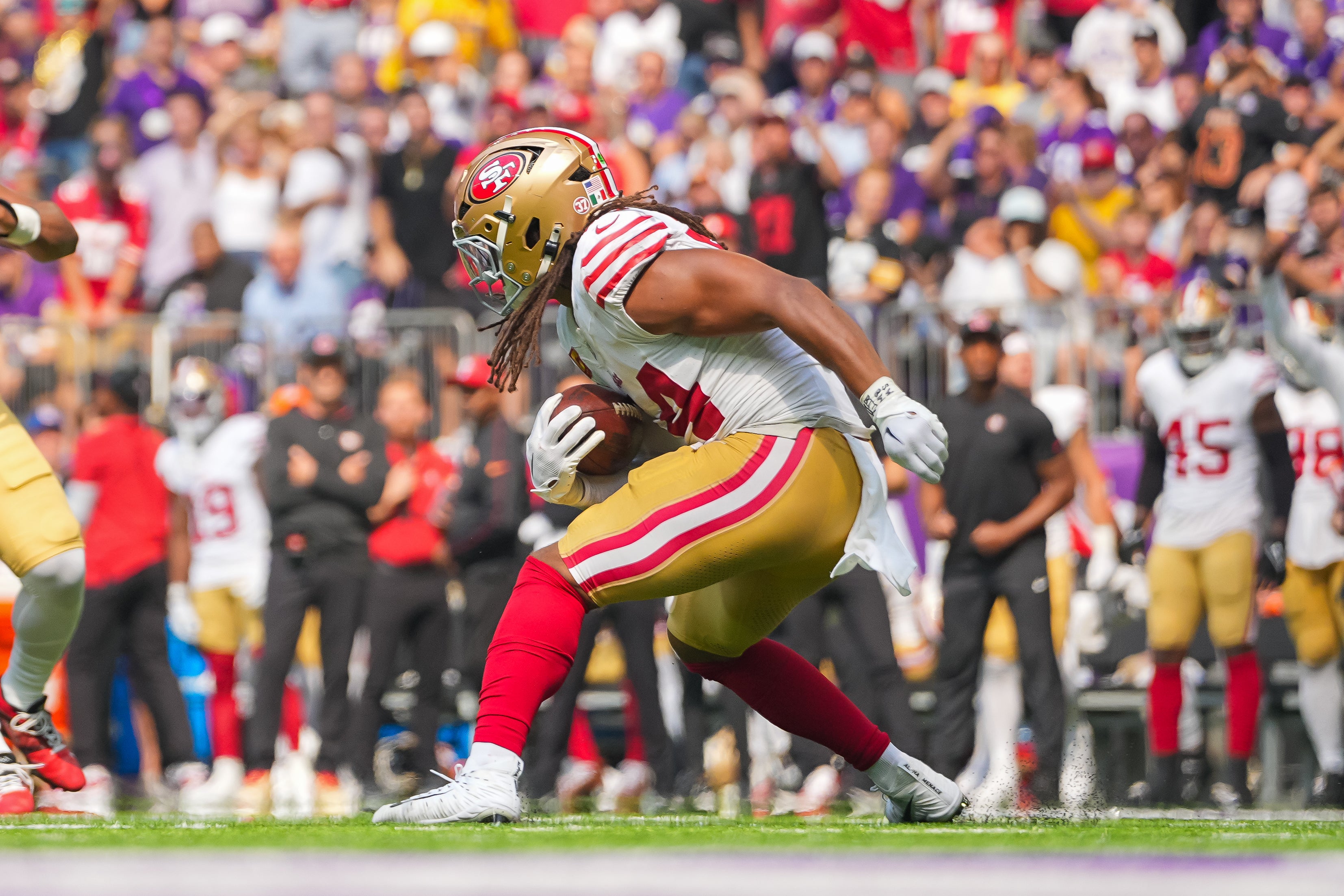 Sep 15, 2024; Minneapolis, Minnesota, USA; San Francisco 49ers linebacker Fred Warner (54) runs back an interception against the Minnesota Vikings in the second quarter at U.S. Bank Stadium.