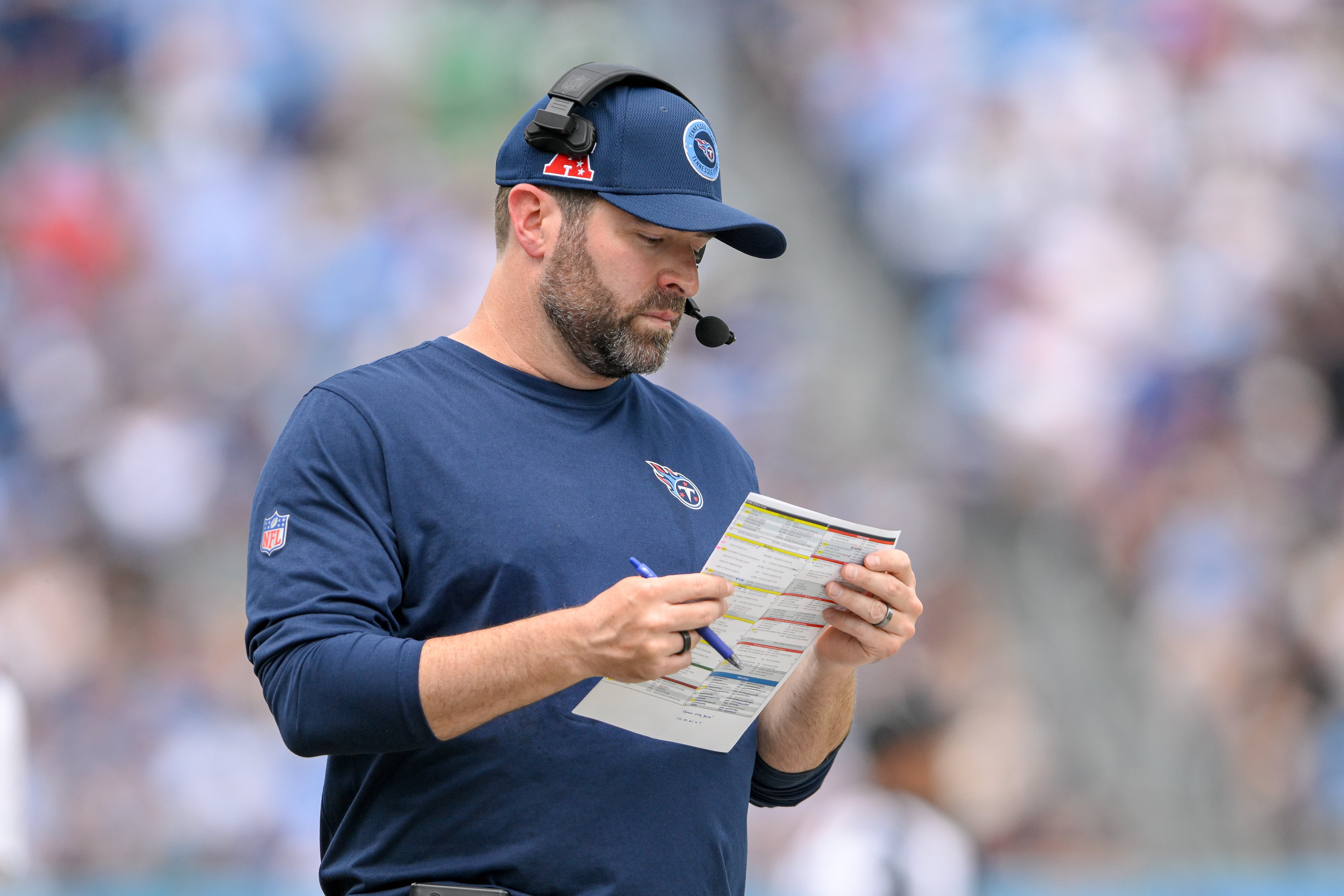Tennessee Titans head coach Brian Callahan looks at his play sheet against the New York Jets during the first half at Nissan Stadium. Steve Roberts-Imagn Images