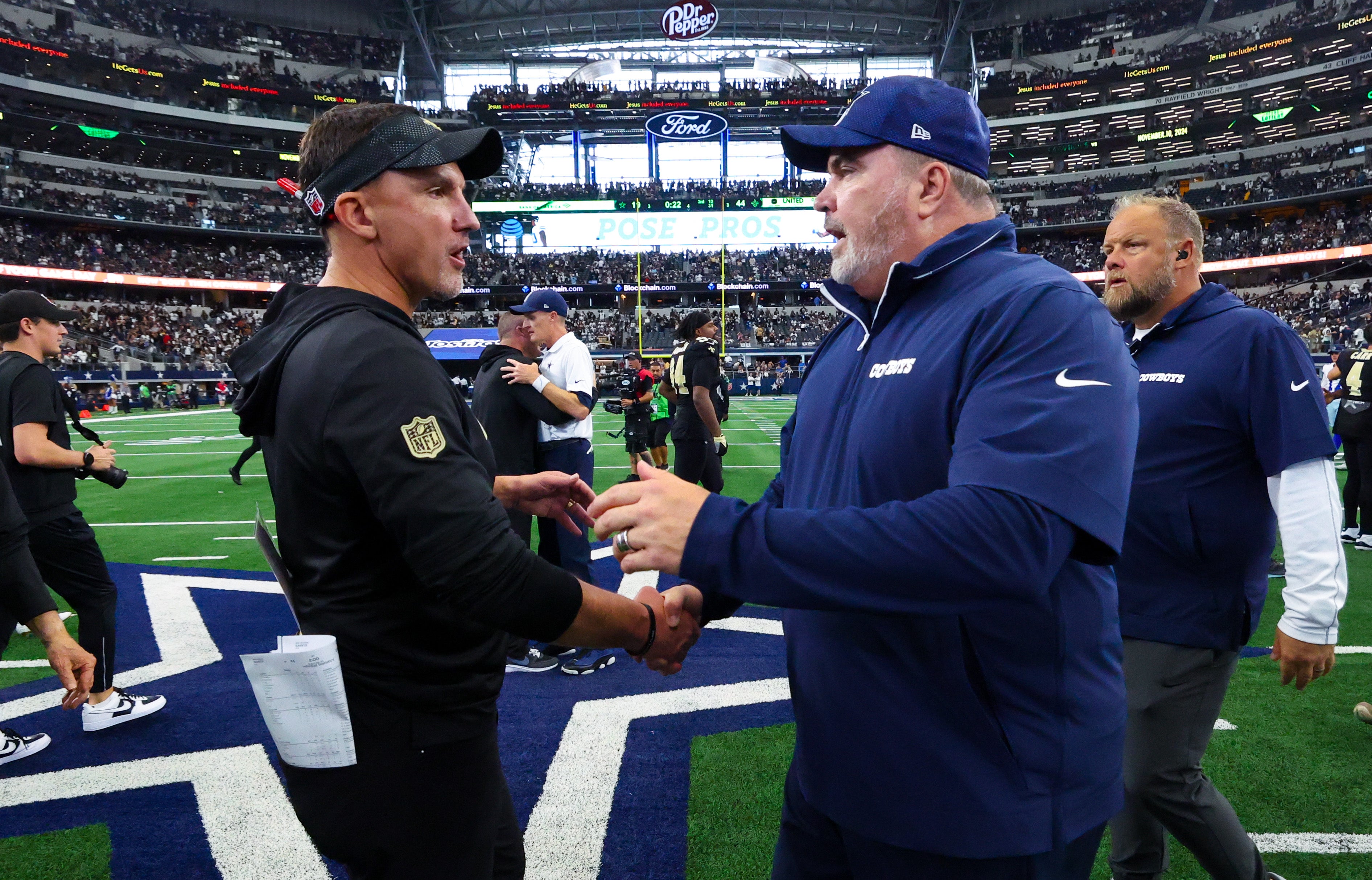 New Orleans Saints head coach Dennis Allen (left) greets Dallas Cowboys head coach Mike McCarthy after the game at AT&T Stadium.