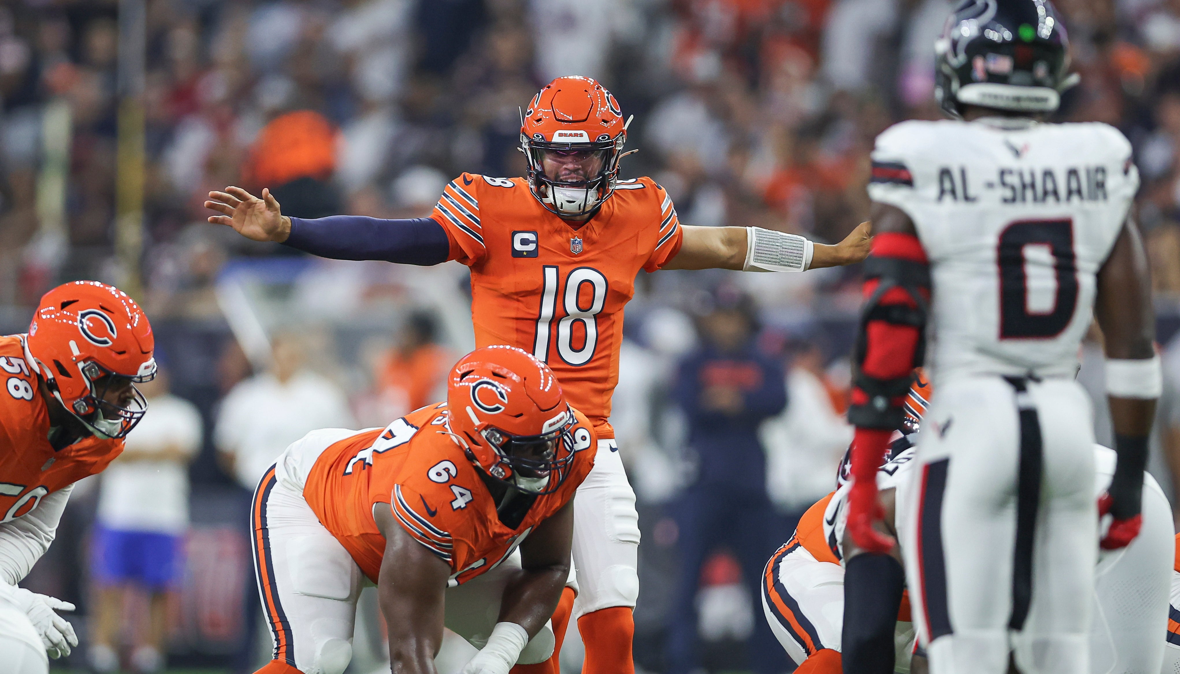 Sep 15, 2024; Houston, Texas, USA; Chicago Bears quarterback Caleb Williams (18) at the line of scrimmage during the first quarter against the Houston Texans at NRG Stadium.