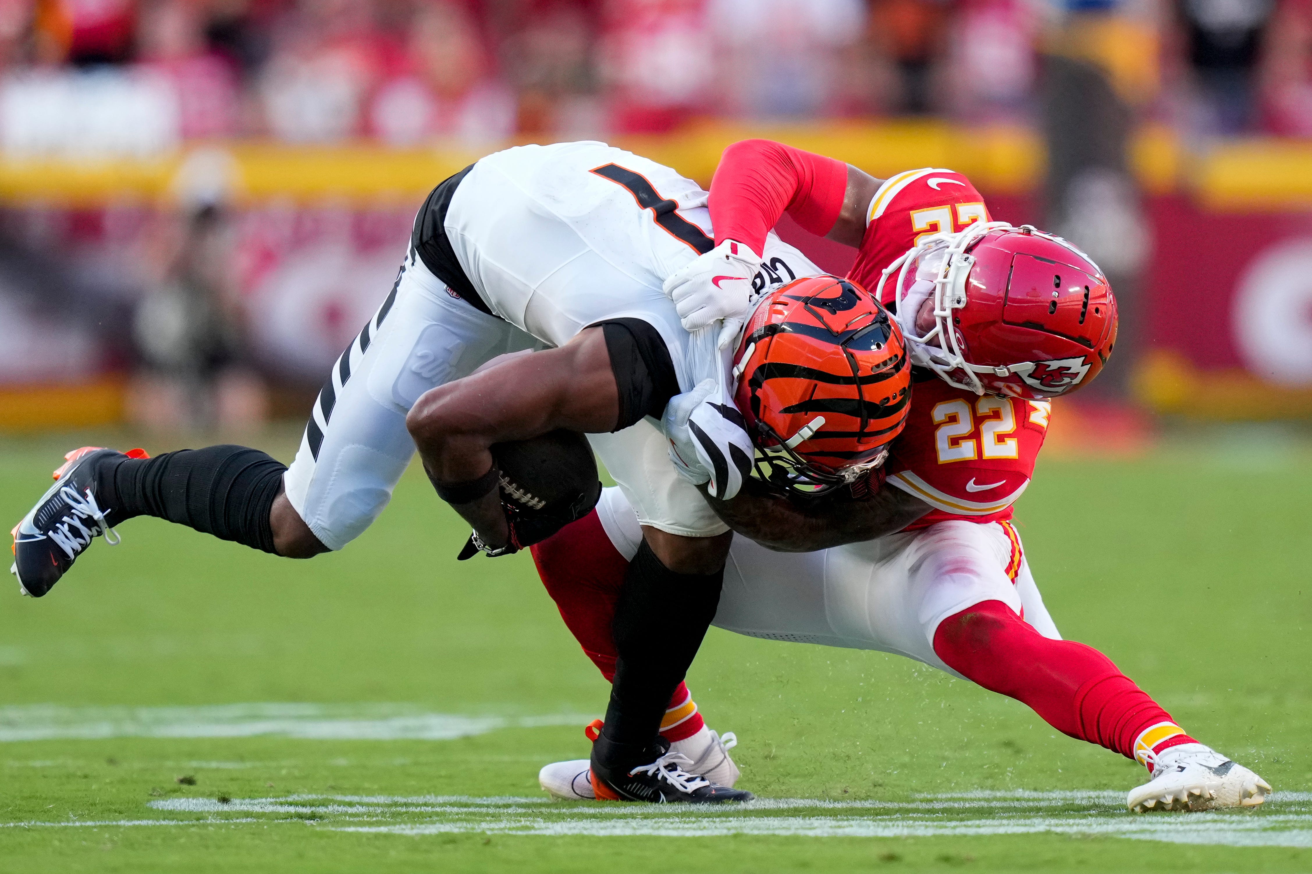 Kansas City Chiefs cornerback Trent McDuffie (22) brings down Cincinnati Bengals wide receiver Ja'Marr Chase (1) in the fourth quarter of the NFL Week 2 game between the Kansas City Chiefs and the Cincinnati Bengals at Arrowhead Stadium in Kansas City on Sunday, Sept. 15, 2024. The Chiefs took a 26-25 win with a go-ahead field goal as time expired.  