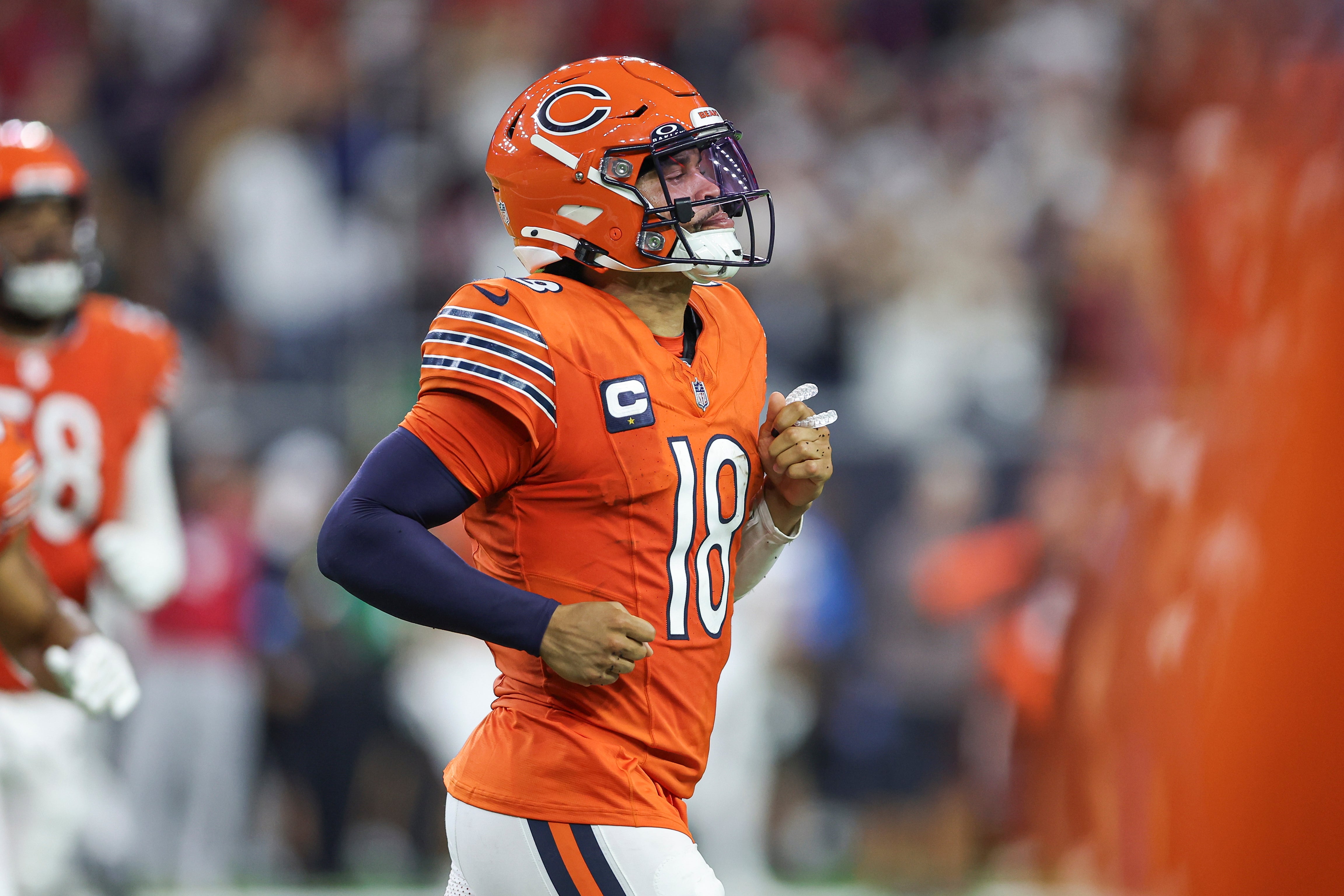 Sep 15, 2024; Houston, Texas, USA; Chicago Bears quarterback Caleb Williams (18) jogs off the field after a play during the third quarter against the Houston Texans at NRG Stadium.