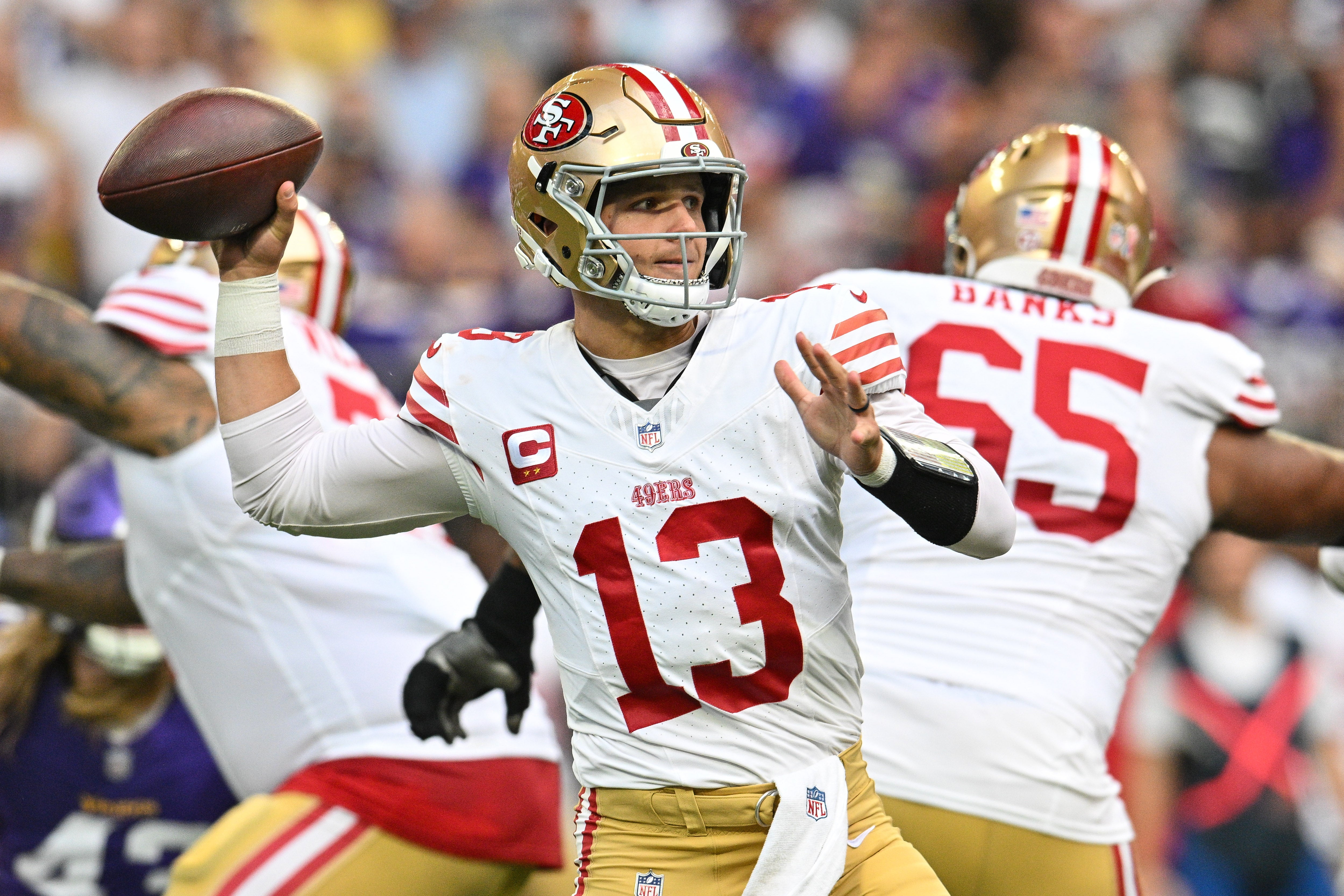 Sep 15, 2024; Minneapolis, Minnesota, USA; San Francisco 49ers quarterback Brock Purdy (13) throws a pass against the Minnesota Vikings during the first quarter U.S. Bank Stadium.