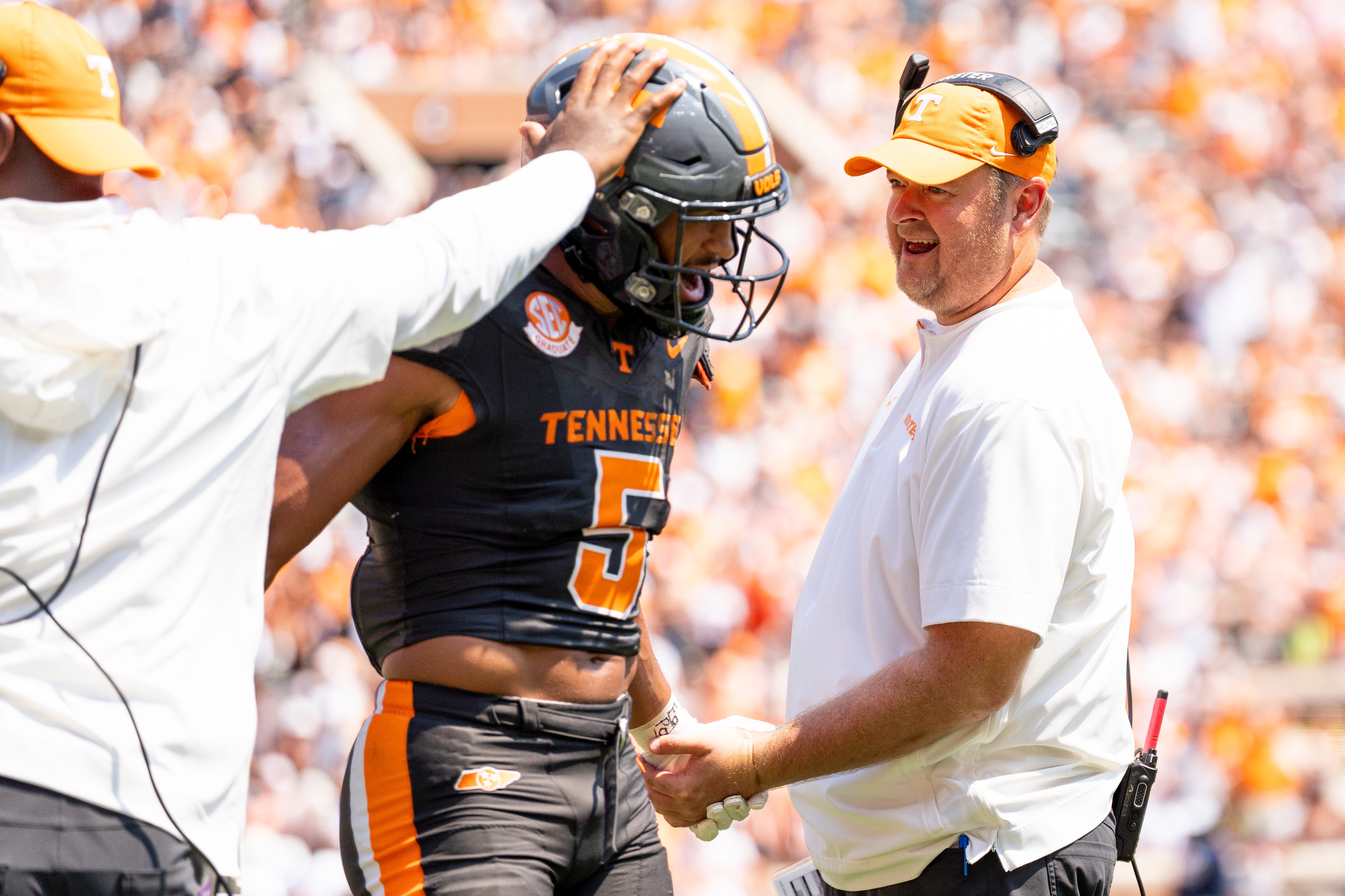Tennessee head coach Josh Heupel congratulates Tennessee wide receiver Bru McCoy (5) after McCoy made a catch during Tennessee's game against Chattanooga in Neyland Stadium in Knoxville on Saturday, Aug. 31, 2024.