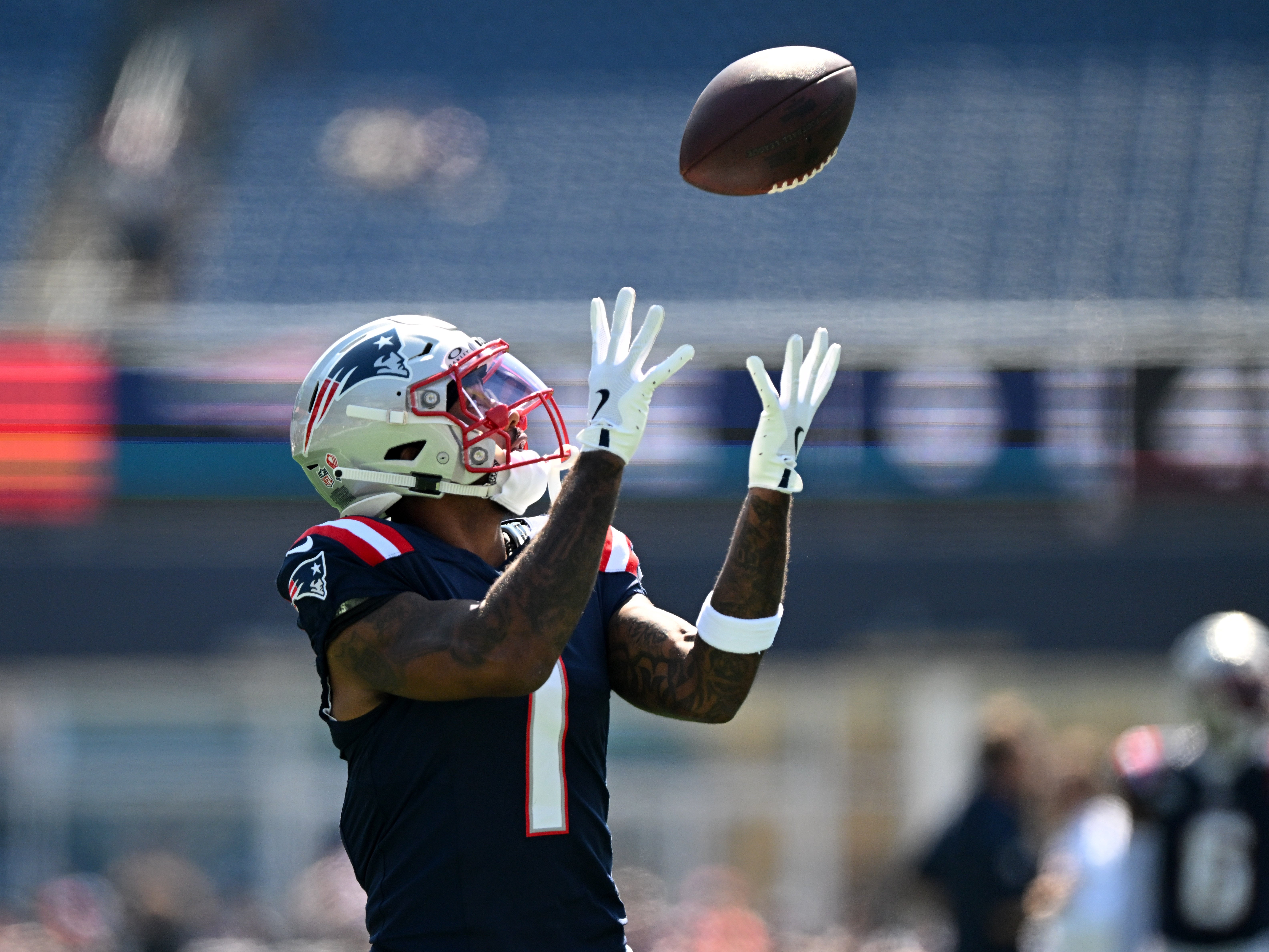 Sep 15, 2024; Foxborough, Massachusetts, USA; New England Patriots wide receiver Ja'Lynn Polk (1) catches the ball during warmups before a game against the Seattle Seahawks at Gillette Stadium.