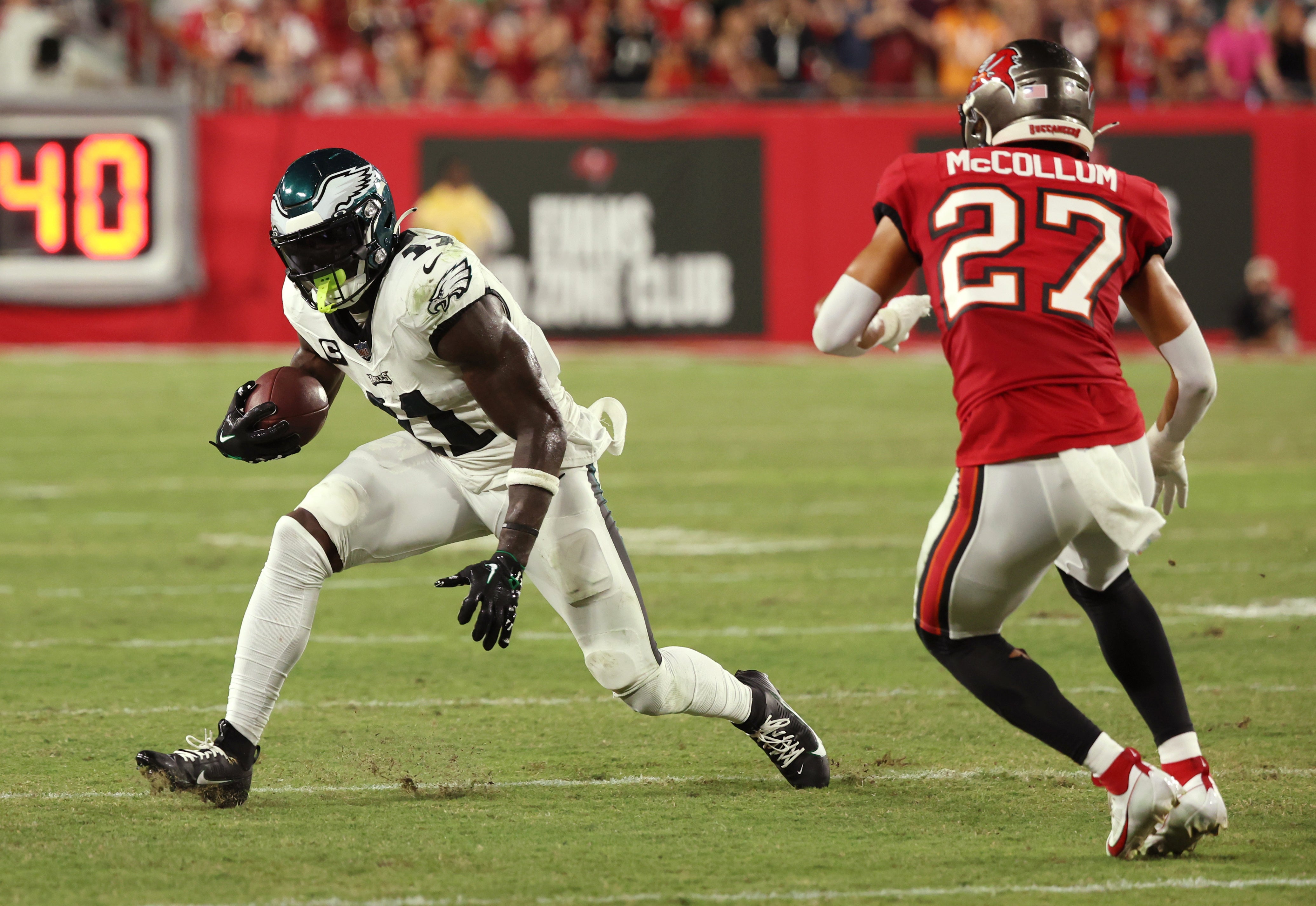Sep 25, 2023; Tampa, Florida, USA; Philadelphia Eagles wide receiver A.J. Brown (11) runs with the ball as Tampa Bay Buccaneers cornerback Zyon McCollum (27) defends during the first half at Raymond James Stadium.