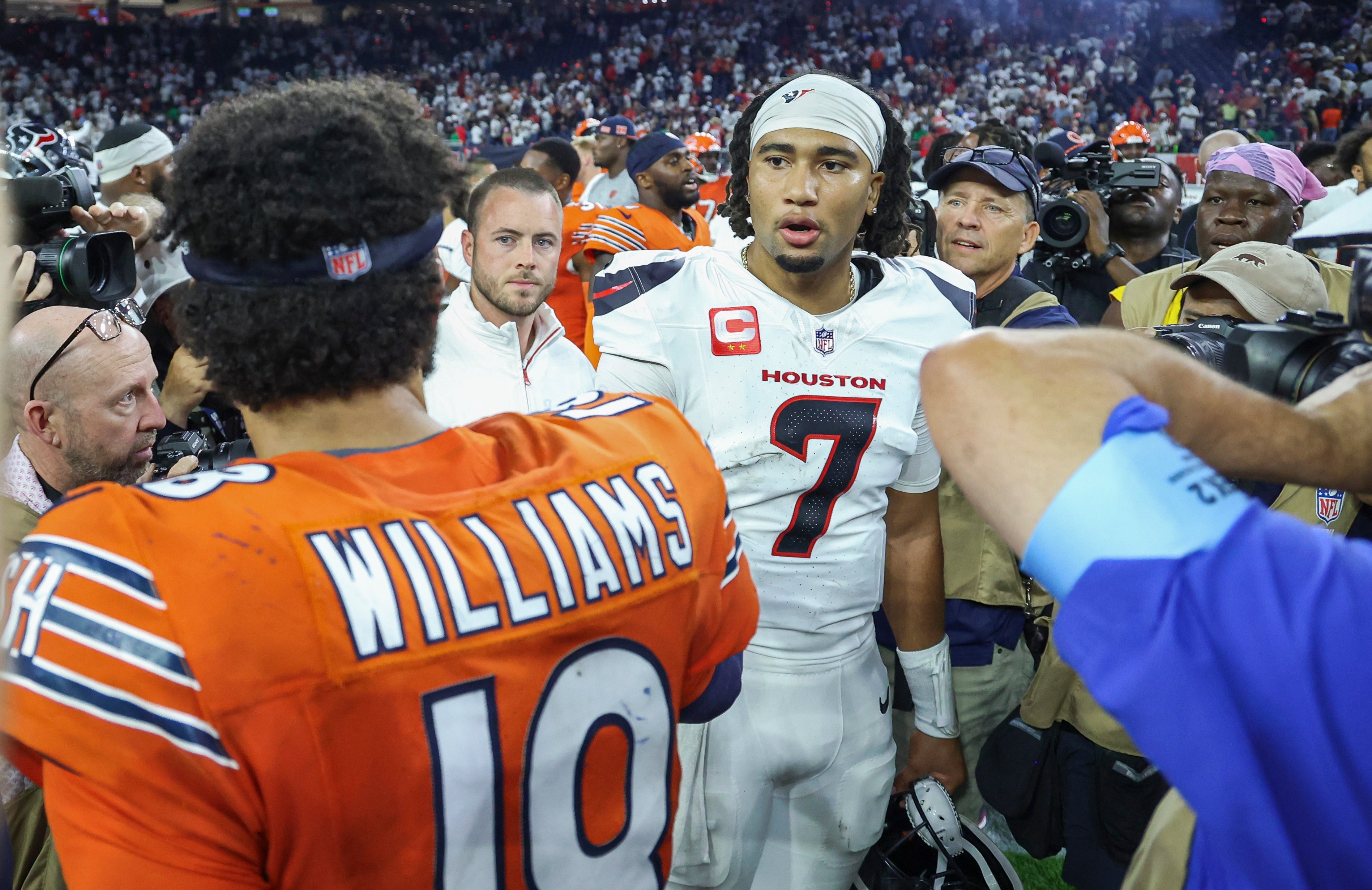 Sep 15, 2024; Houston, Texas, USA; Houston Texans quarterback C.J. Stroud (7) talks with Chicago Bears quarterback Caleb Williams (18) on the field after the game at NRG Stadium.