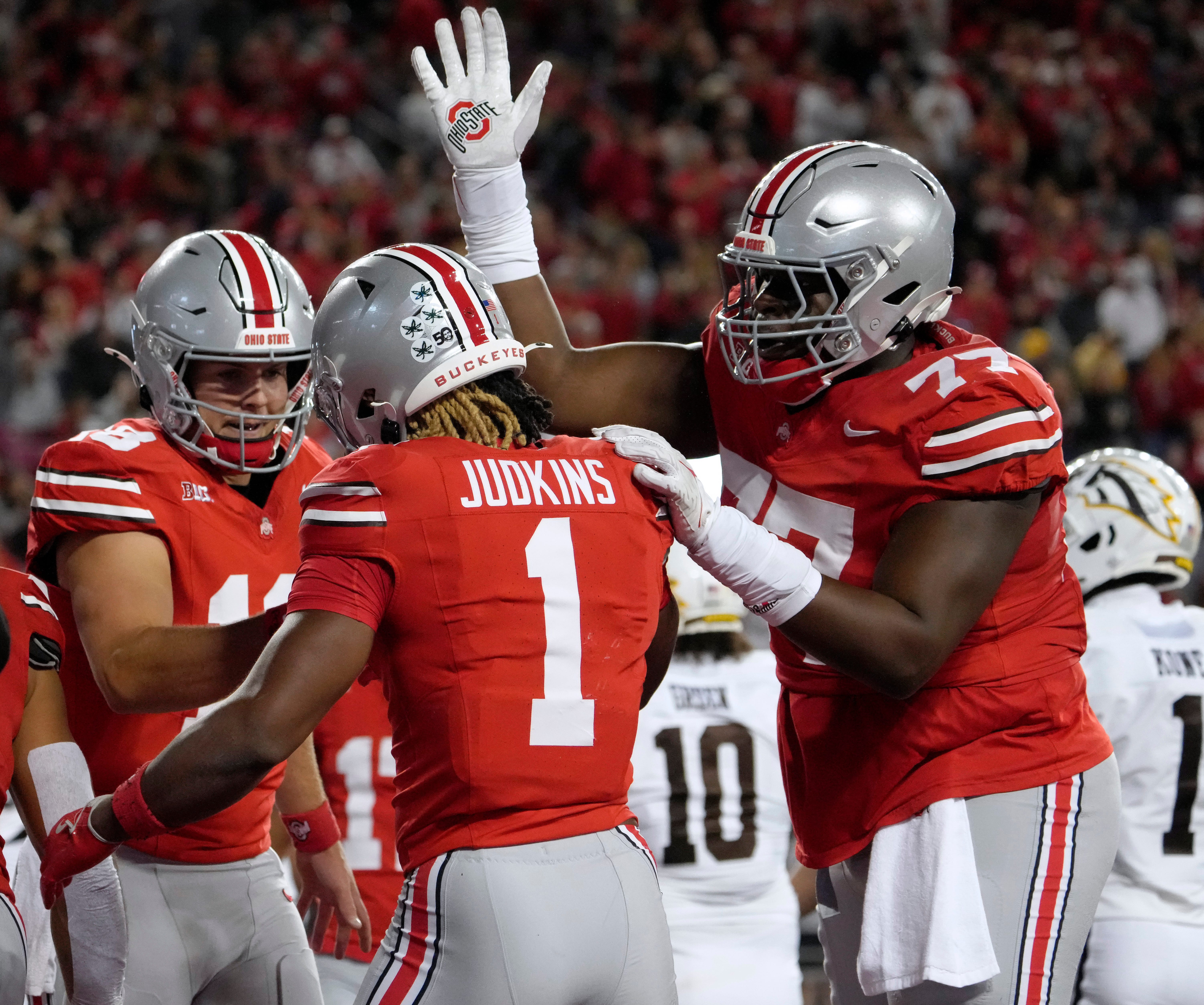 Sept. 7, 2024; Columbus, Ohio, USA; Ohio State Buckeyes quarterback Will Howard (18) congratulates Ohio State Buckeyes running back Quinshon Judkins (1) after a touchdown during the first half of an NCAA Division I football game against the Western Michigan Broncos on Saturday at Ohio Stadium.