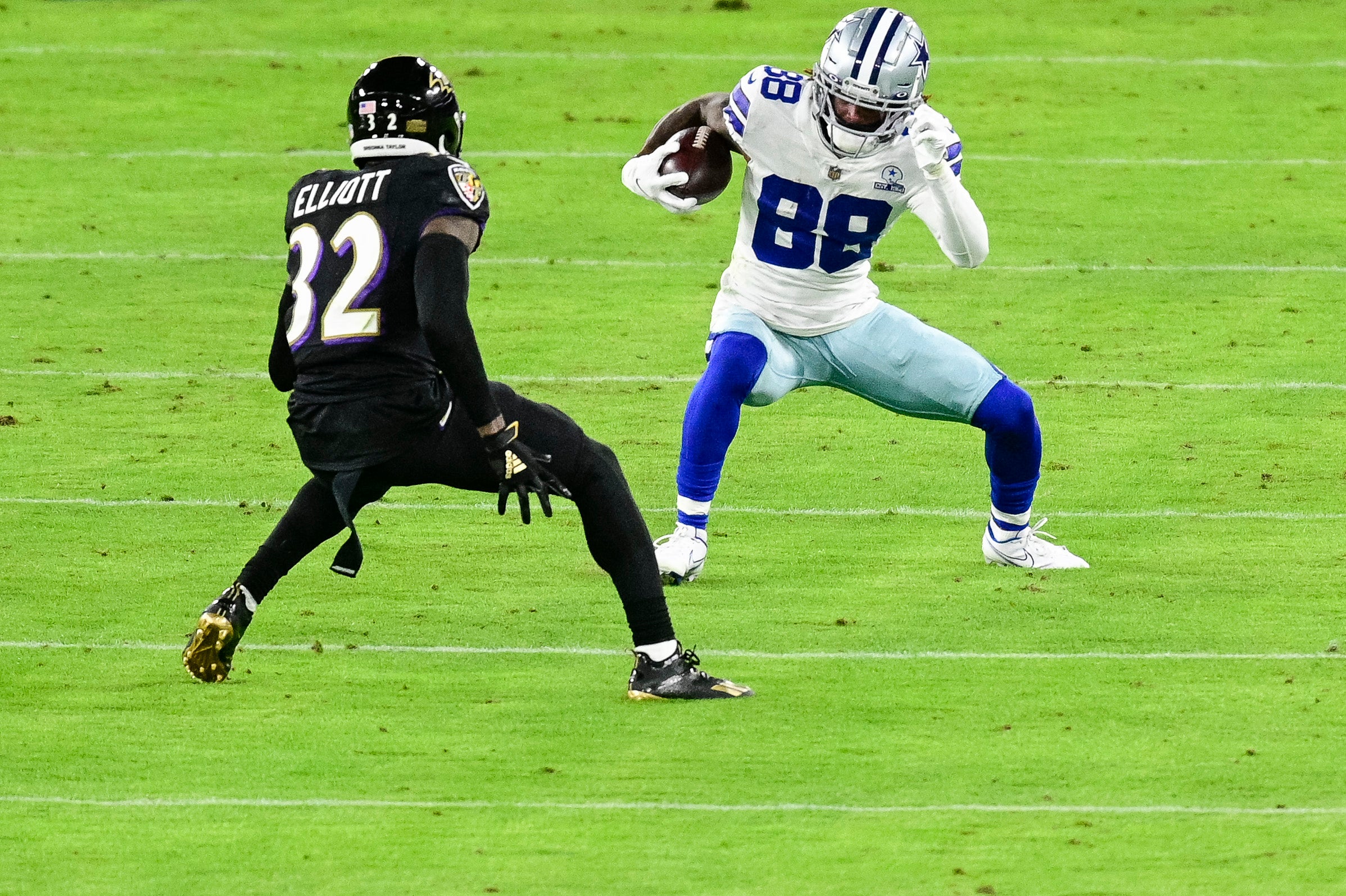 Dallas Cowboys wide receiver CeeDee Lamb (88) runs as Baltimore Ravens free safety DeShon Elliott (32) defends during the second quarter at M&T Bank Stadium.