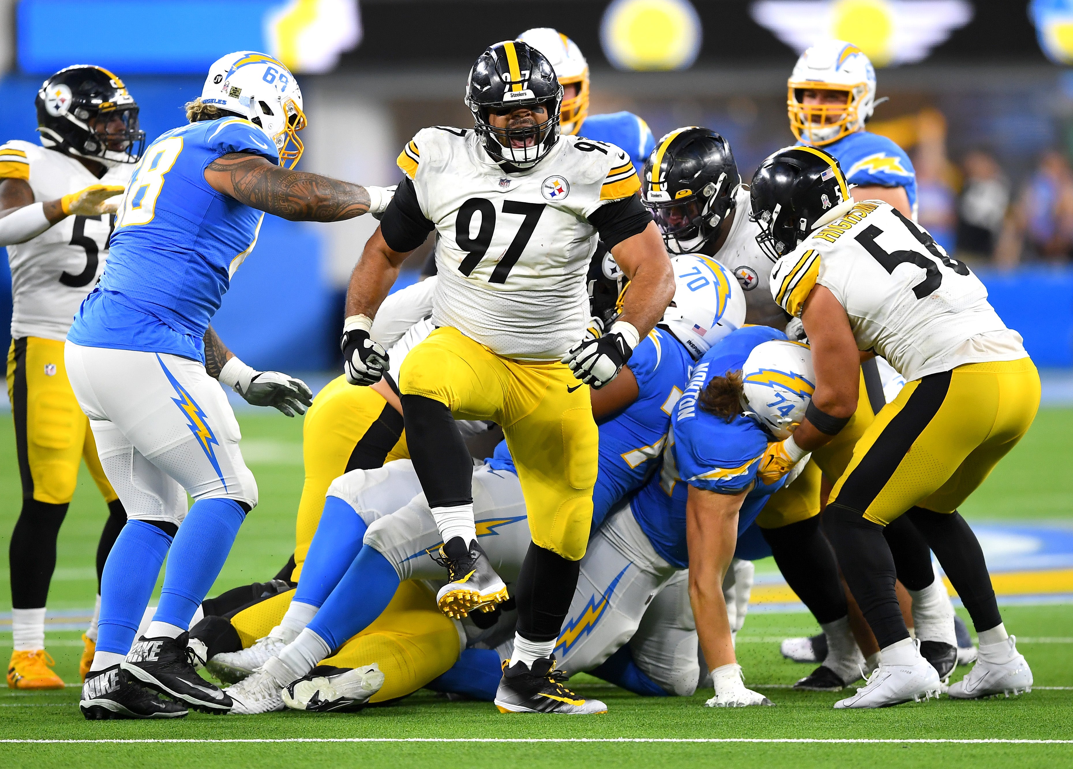 Nov 21, 2021; Inglewood, California, USA; Pittsburgh Steelers defensive end Cameron Heyward (97) celebrates after Los Angeles Chargers running back Austin Ekeler (30) was stopped short of a first down in the fourth quarter of the game at SoFi Stadium. Mandatory Credit: Jayne Kamin-Oncea-Imagn Images  