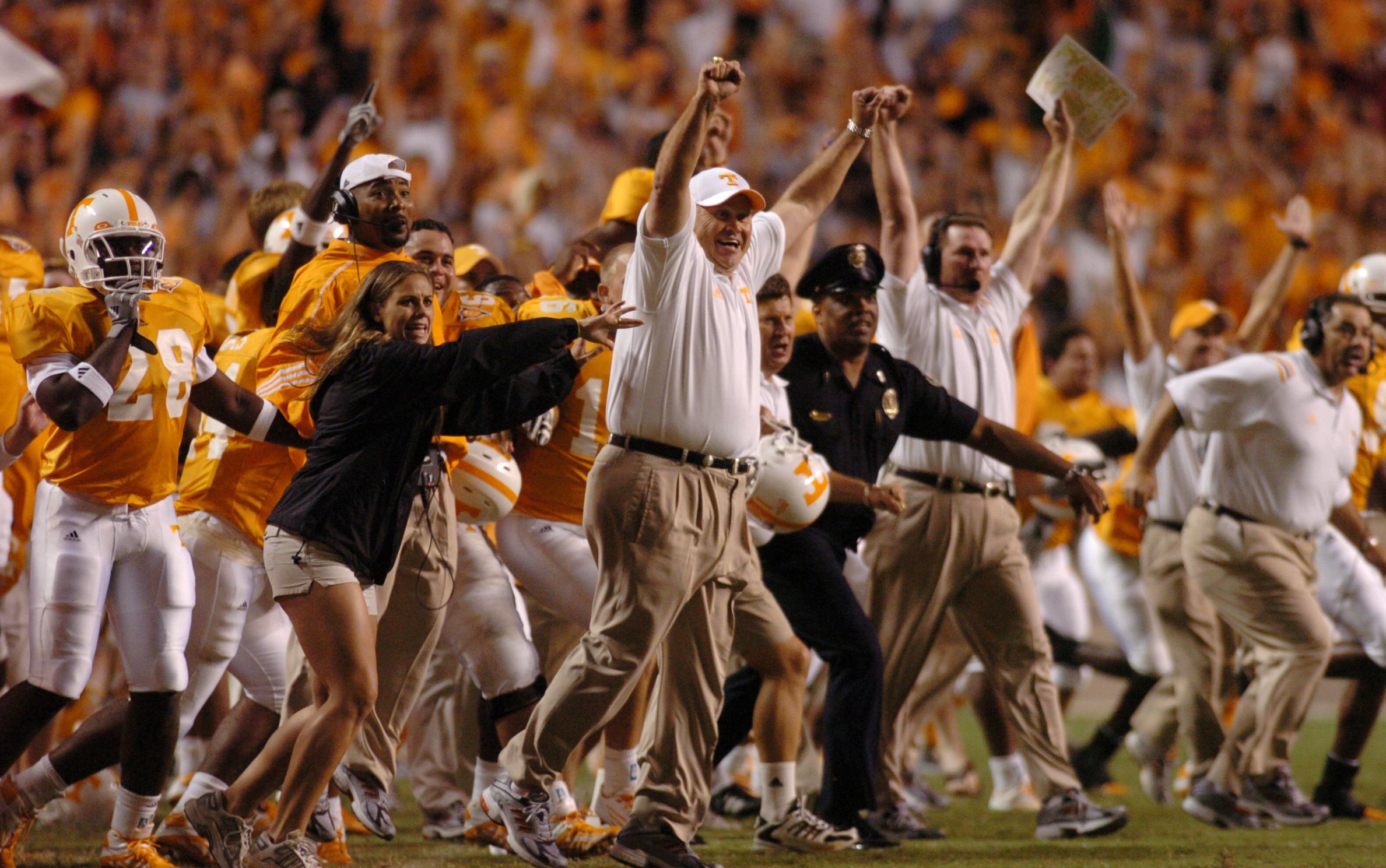 Tennessee's coach Phil Fulmer and the rest of Tennessee's sideline pile onto the field after James Wilhoit's game-winning field goal kick against Florida at Neyland Stadium.