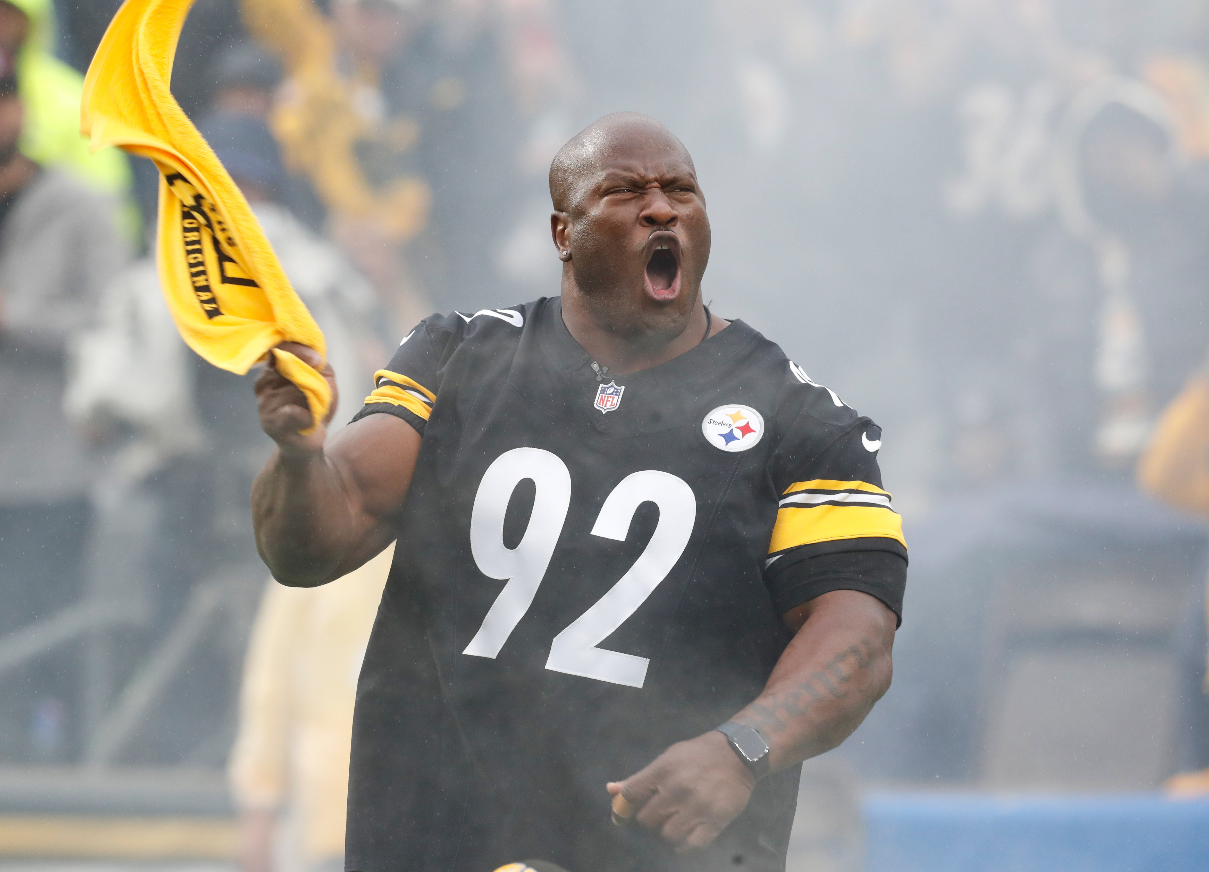 Oct 29, 2023; Pittsburgh, Pennsylvania, USA; Pittsburgh Steelers former linebacker James Harrison (92) leads the Terrible Towel wave against the Jacksonville Jaguars at Acrisure Stadium. Mandatory Credit: Charles LeClaire-Imagn Images