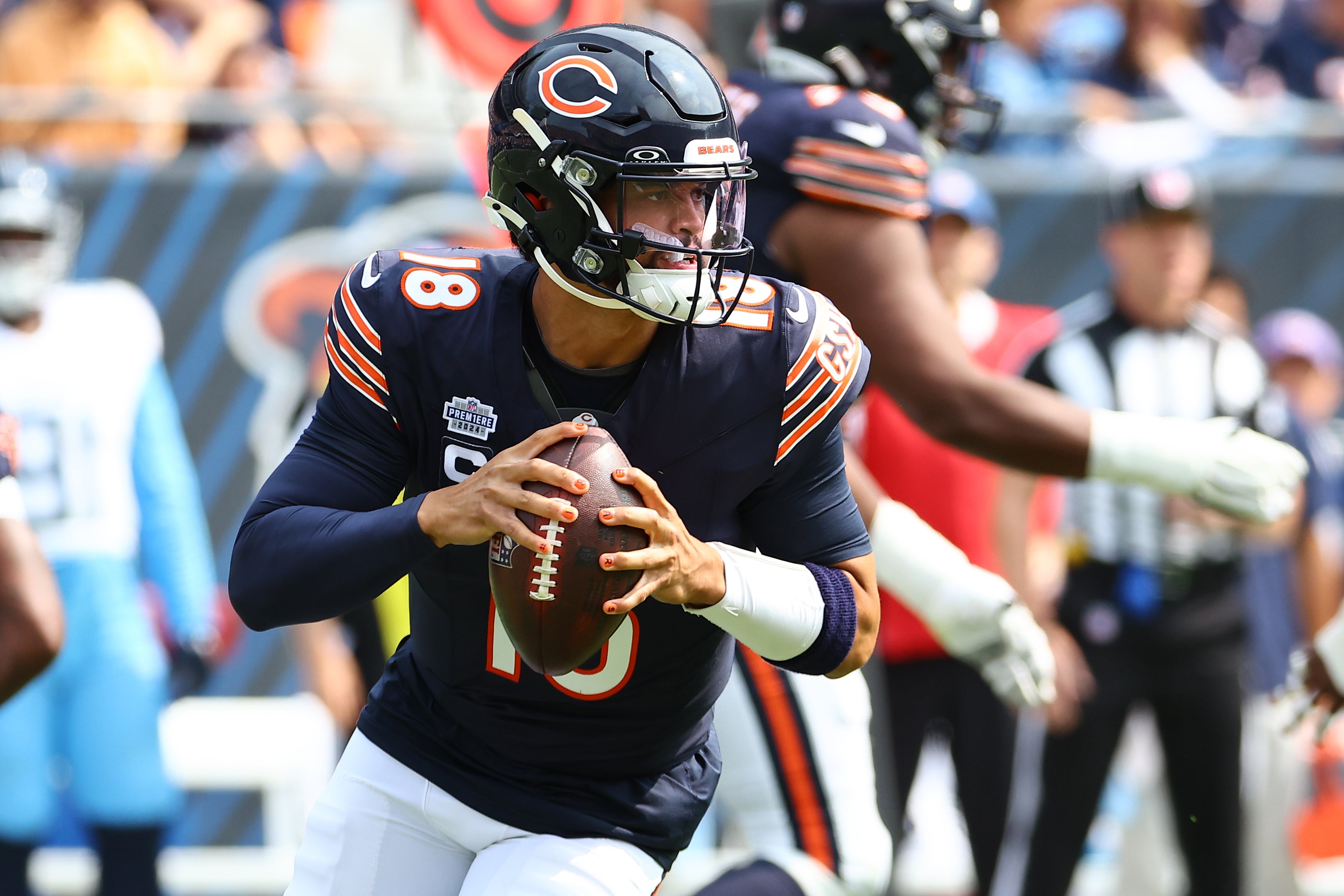 Sep 8, 2024; Chicago, Illinois, USA; Chicago Bears quarterback Caleb Williams (18) drops back to pass against the Tennessee Titans during the second quarter at Soldier Field.