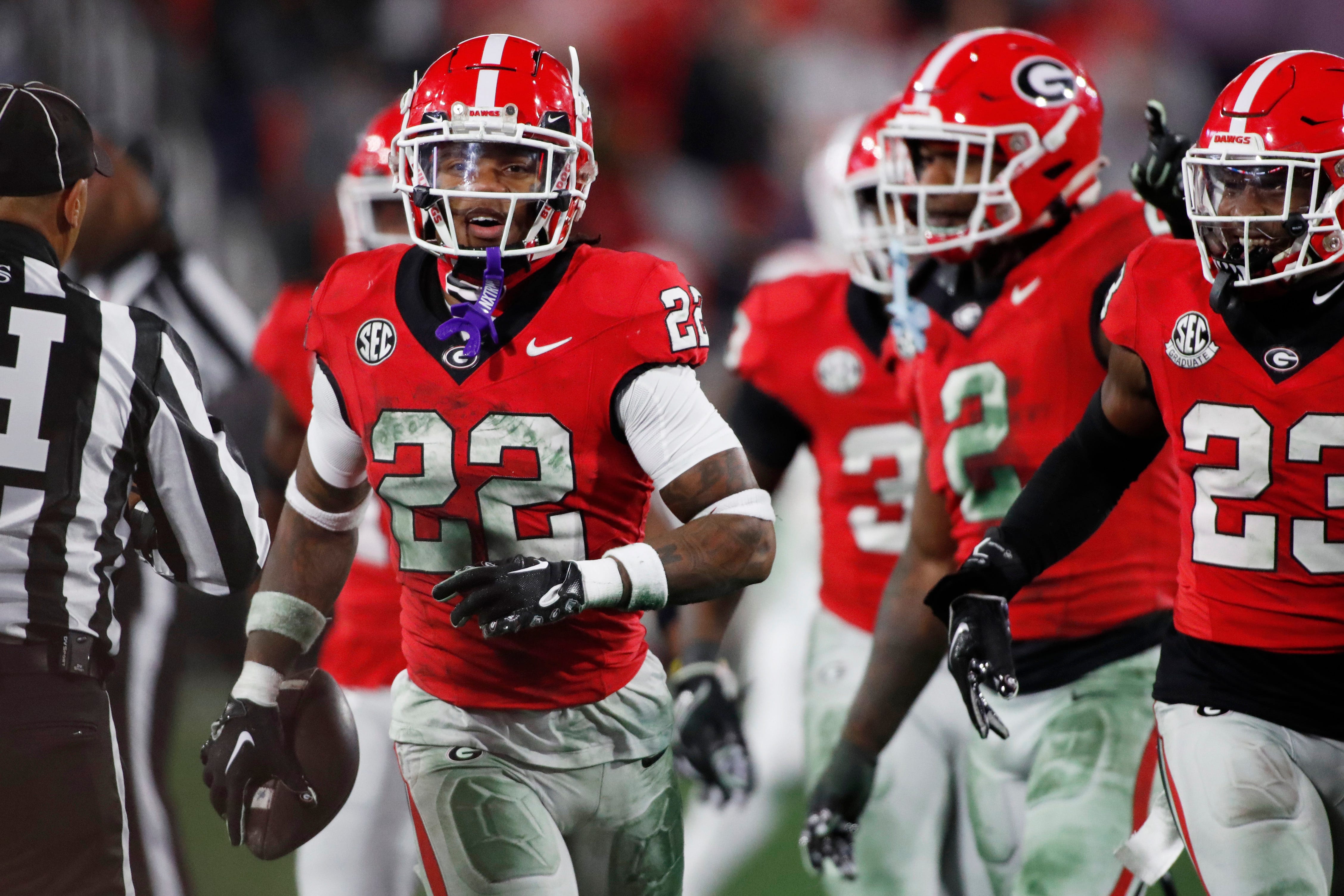 Georgia defensive back Javon Bullard (22) celebrates after piking off a pass from Ole Miss quarterback Jaxson Dart (2) during the first half of a NCAA college football game against Ole Miss in Athens.