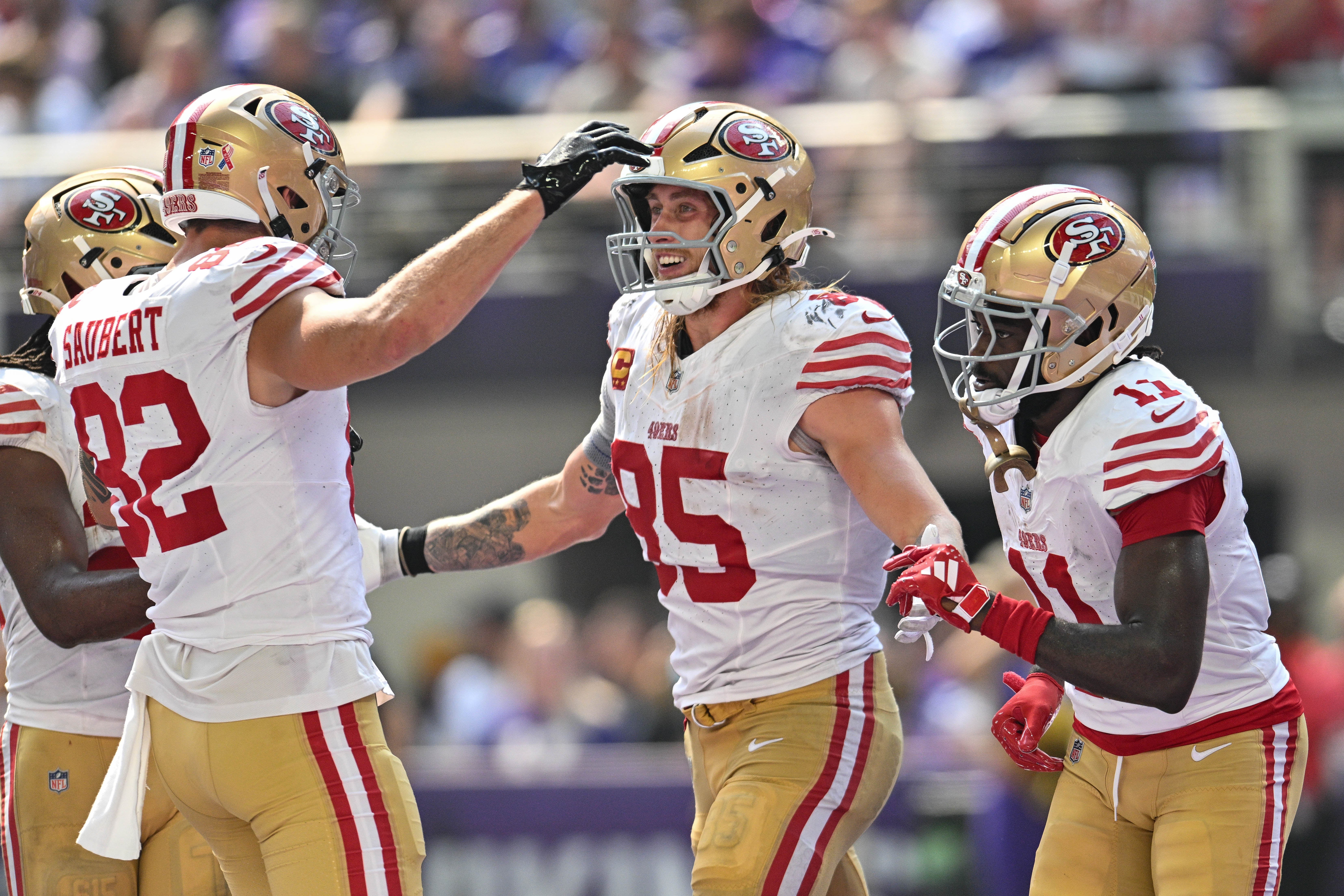 Sep 15, 2024; Minneapolis, Minnesota, USA; San Francisco 49ers tight end George Kittle (85) and wide receiver Brandon Aiyuk (11) and tight end Eric Saubert (82) react after a touchdown by Kittle during the second quarter against the Minnesota Vikings U.S. Bank Stadium.