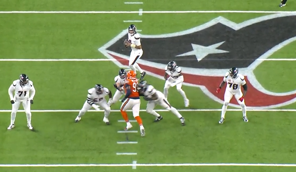 Gervon Dexter Sr. rushes C.J. Stroud in the second quarter.