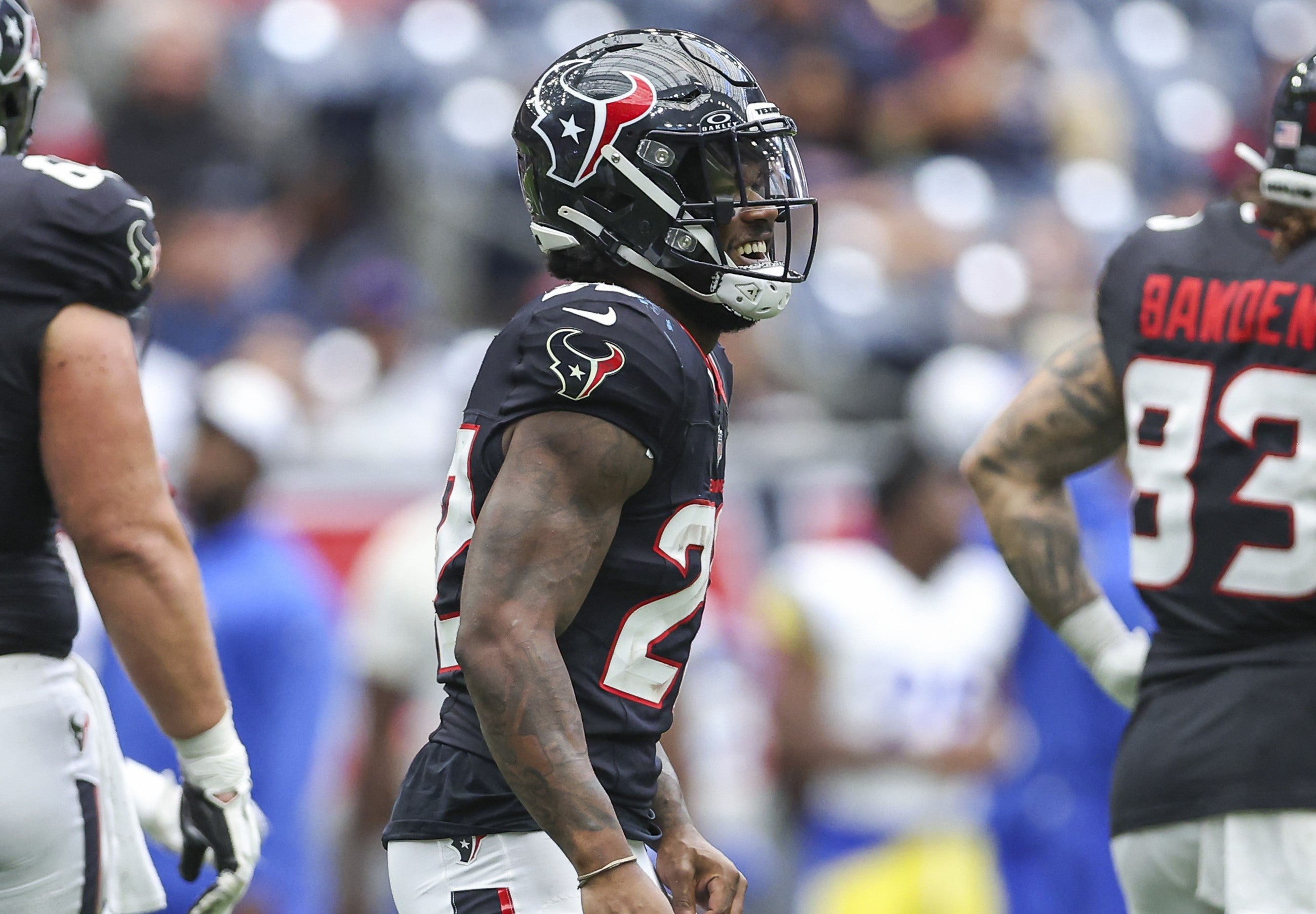 Aug 24, 2024; Houston, Texas, USA; Houston Texans running back Cam Akers (22) smiles after a play during the third quarter against the Los Angeles Rams at NRG Stadium.