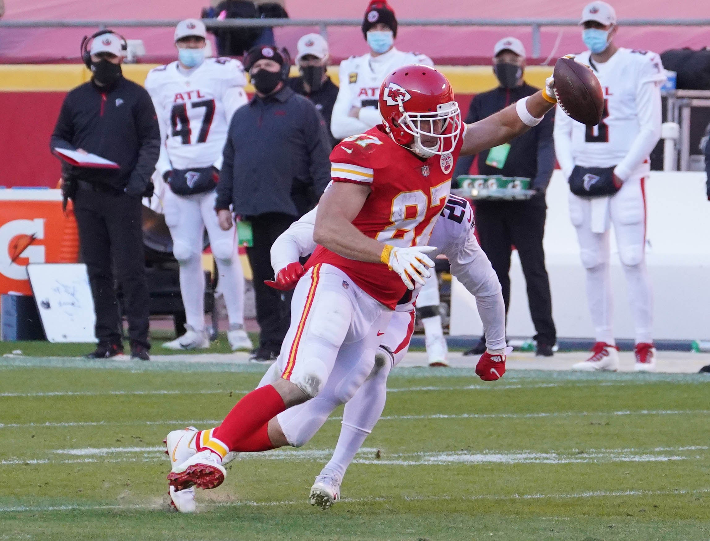 Dec 27, 2020; Kansas City, MO, USA; Kansas City Chiefs tight end Travis Kelce (87) catches a pass against Atlanta Falcons defensive back Kendall Sheffield (20) in the fourth quarter of a NFL game at Arrowhead Stadium.