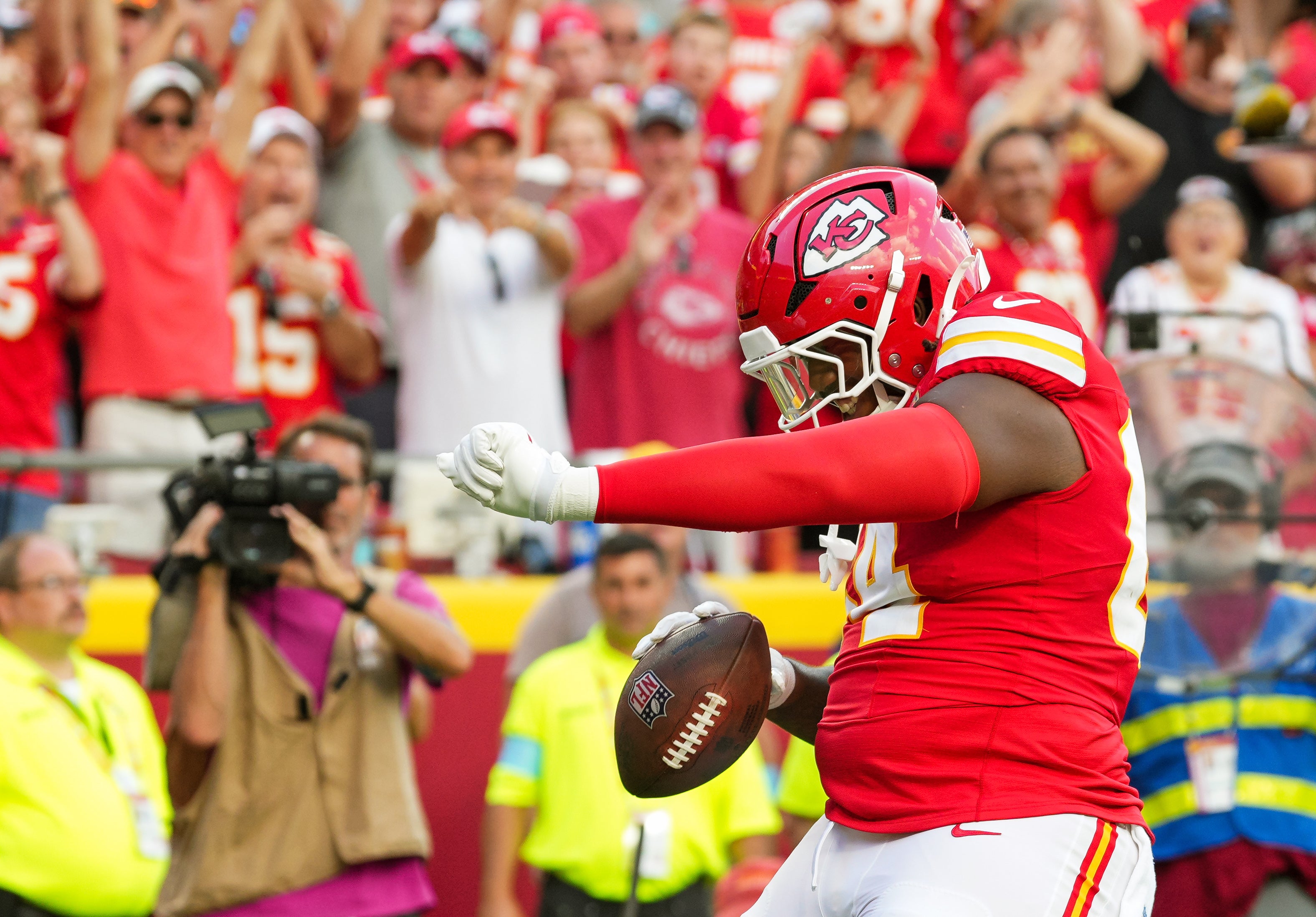 Sep 15, 2024; Kansas City, Missouri, USA; Kansas City Chiefs offensive tackle Wanya Morris (64) celebrates after scoring a touchdown during the second half against the Cincinnati Bengals at GEHA Field at Arrowhead Stadium.