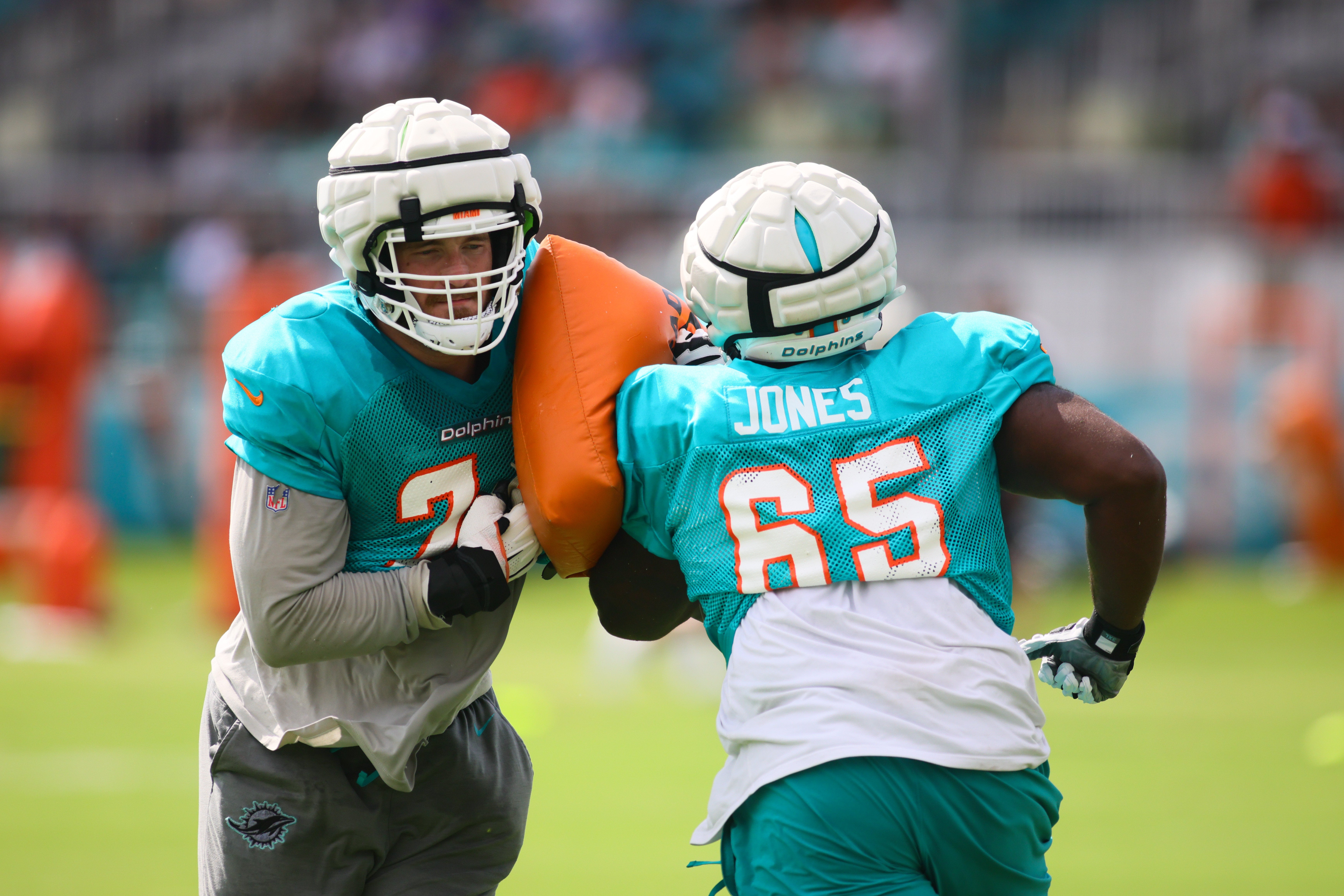 Aug 6, 2024; Miami Gardens, FL, USA; Miami Dolphins offensive tackle Liam Eichenberg (74) works out with guard Robert Jones (65) during a joint practice with the Atlanta Falcons at Baptist Health Training Complex.