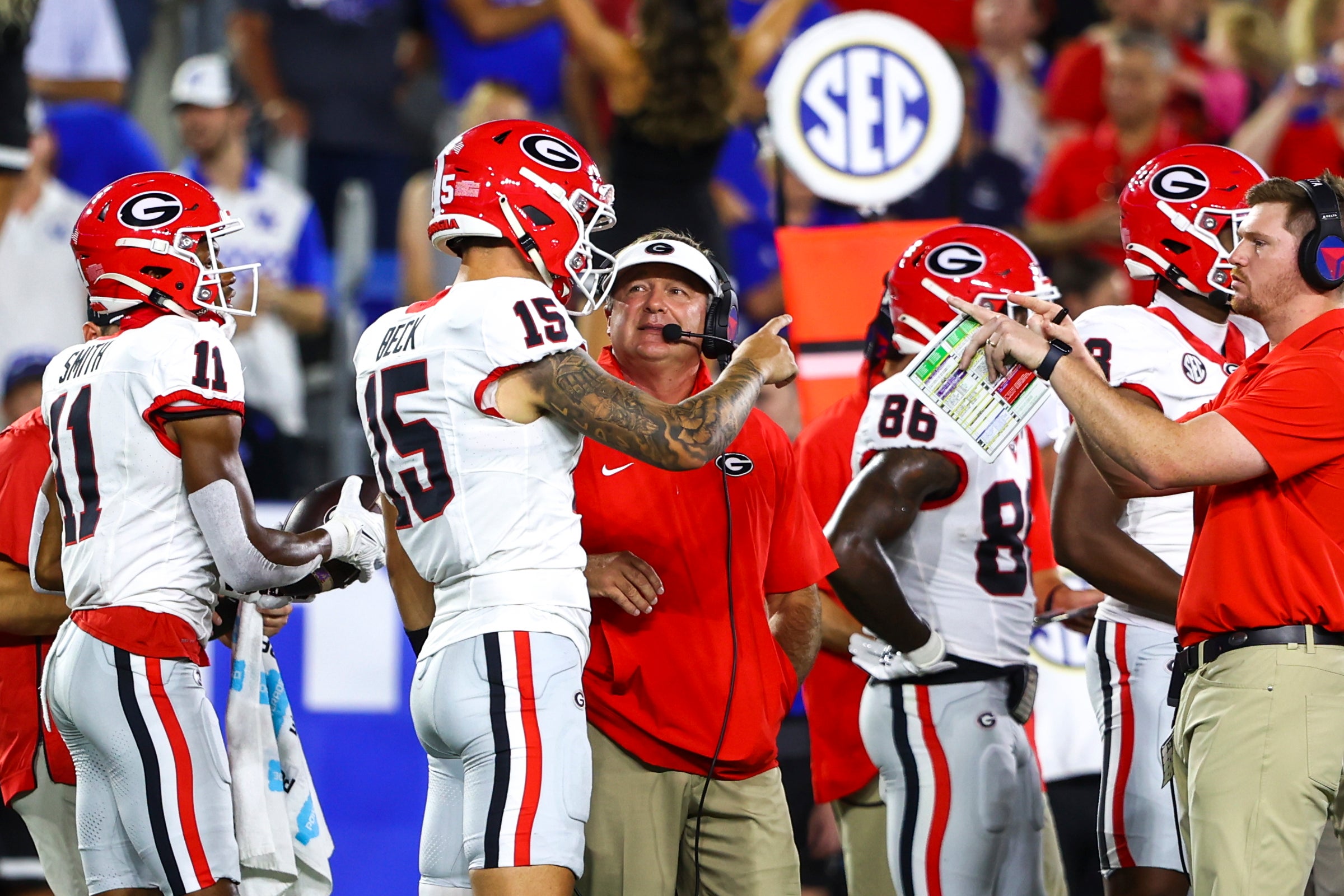 Sep 14, 2024; Lexington, Kentucky, USA; Georgia Bulldogs head coach Kirby Smart talks to quarterback Carson Beck (15) on the sidelines during the first quarter against the Kentucky Wildcats at Kroger Field.