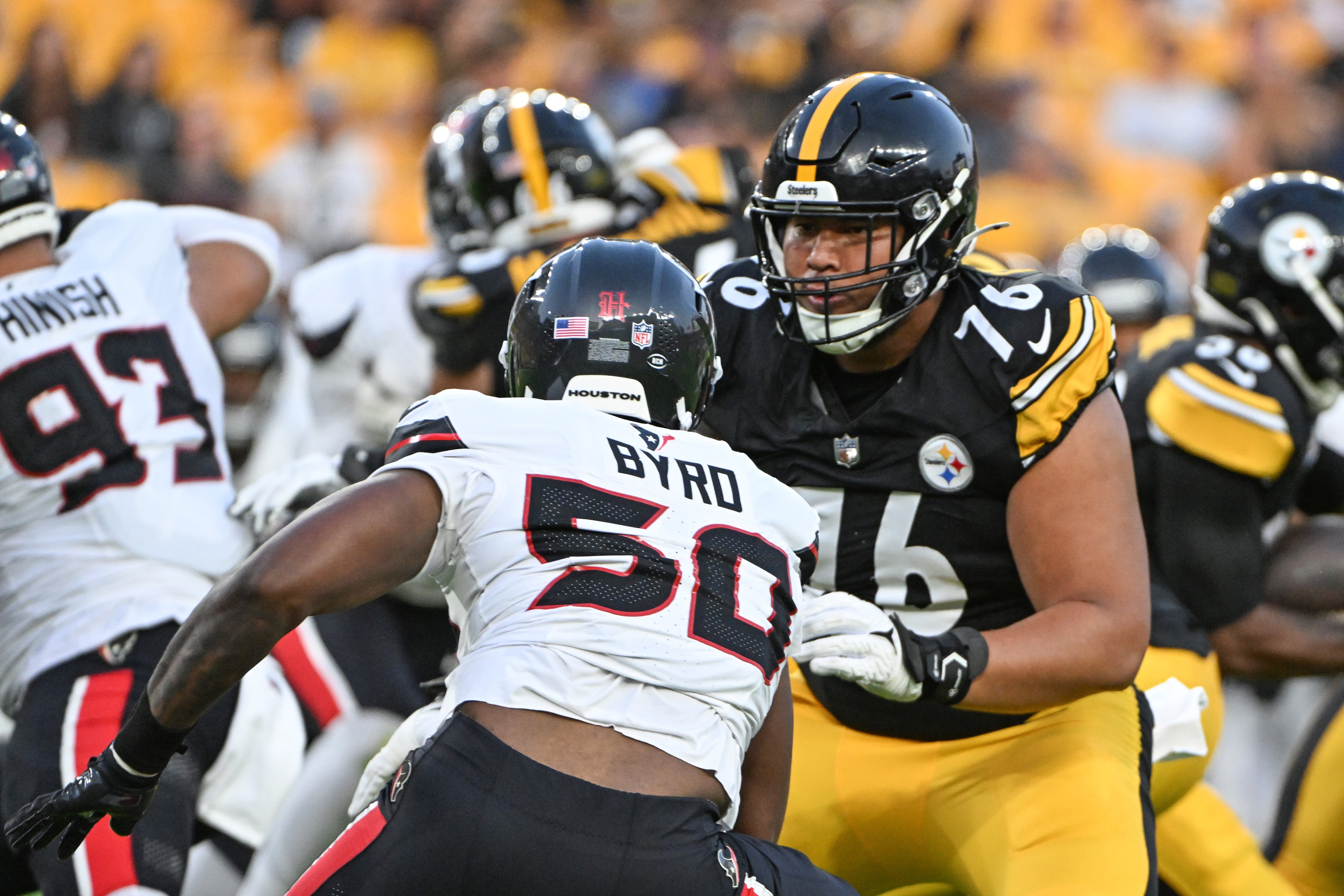 Aug 9, 2024; Pittsburgh, Pennsylvania, USA; Pittsburgh Steelers offensive tackle Troy Fautanu (76) blocks Houston Texans defensive end Solomon Byrd (50) during the first quarter at Acrisure Stadium. Mandatory Credit: Barry Reeger-Imagn Images