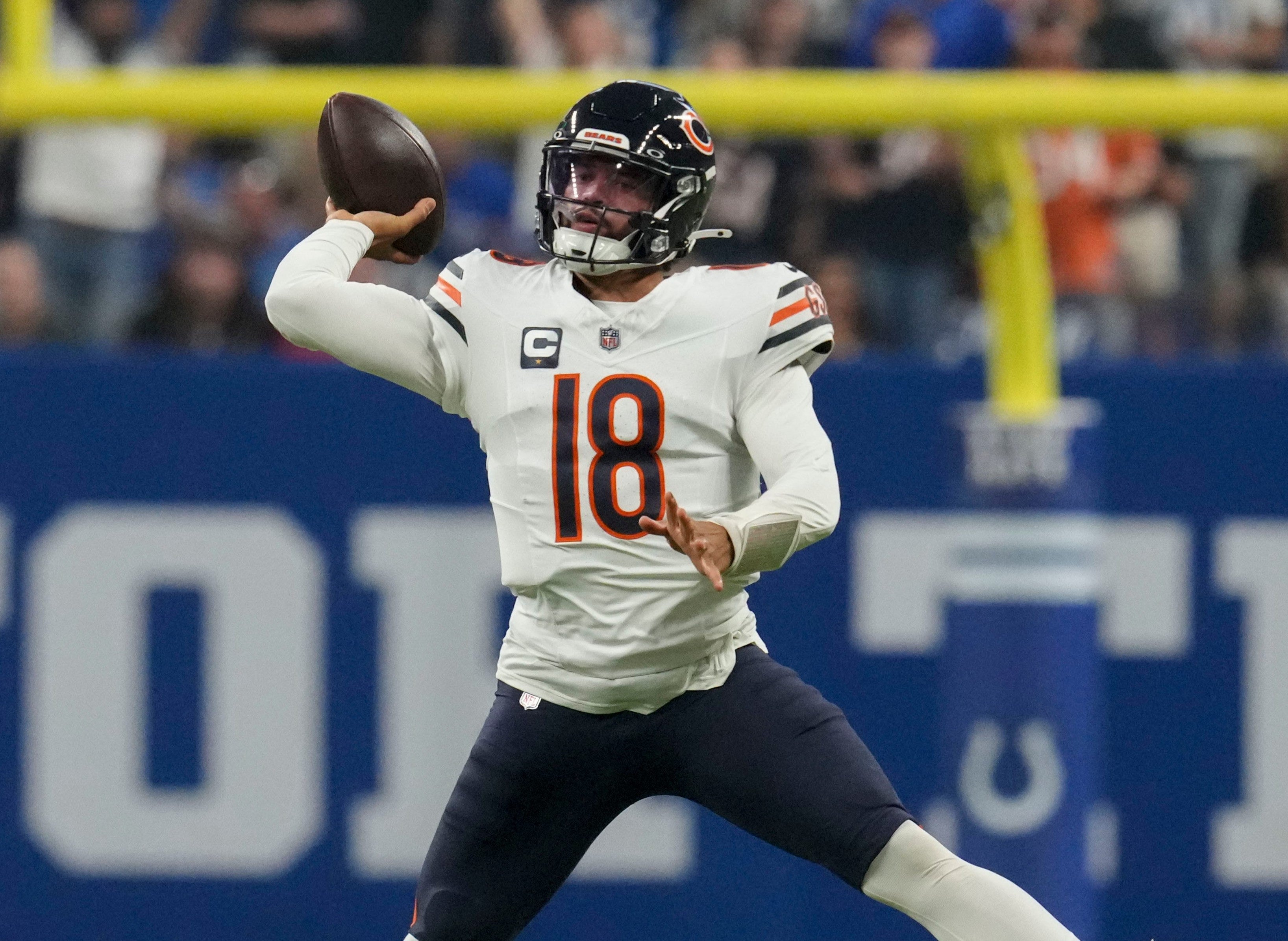 Caleb Williams attempts to pass against the Indianapolis Colts at Lucas Oil Stadium.