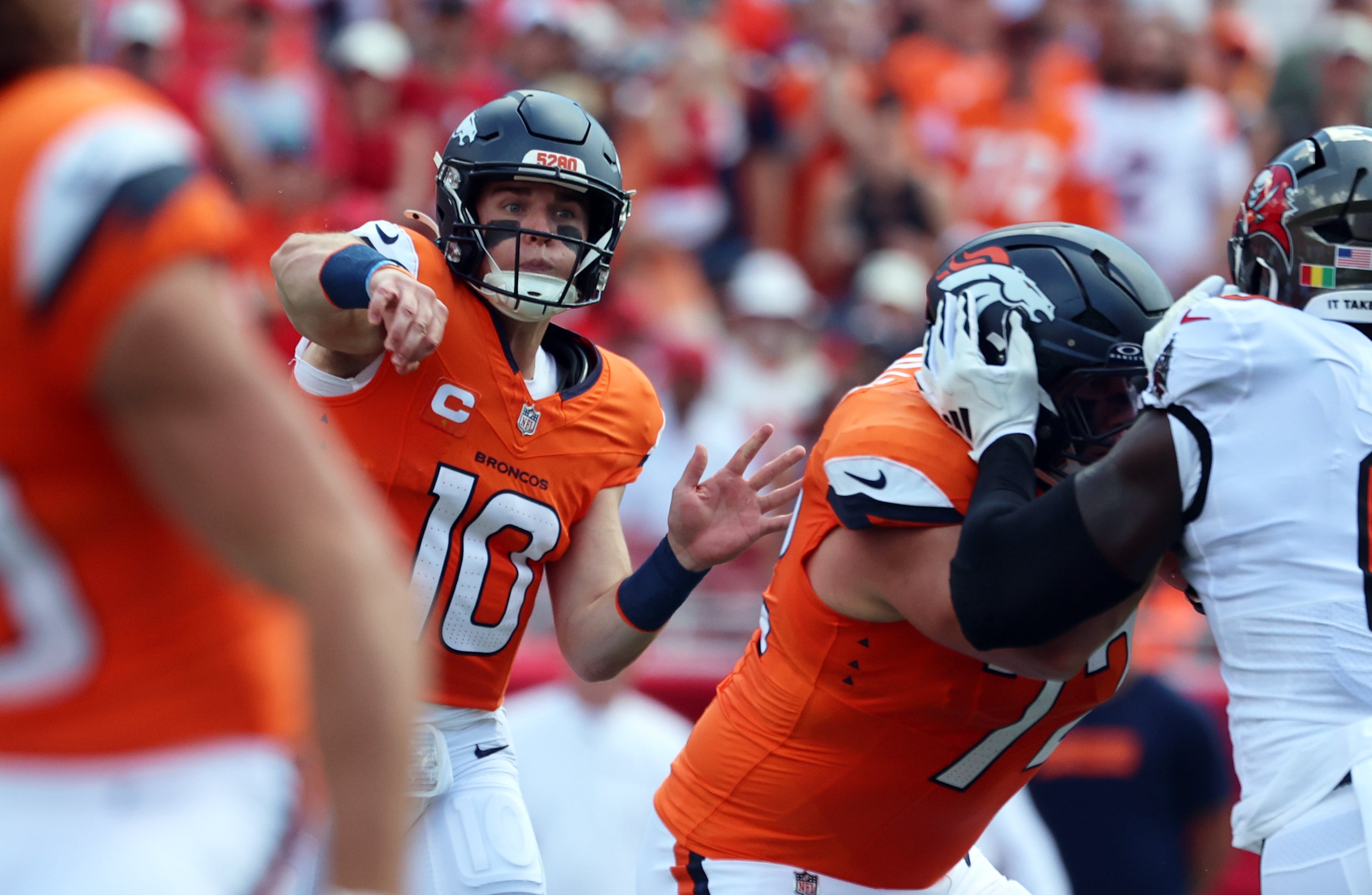 Sep 22, 2024; Tampa, Florida, USA; Denver Broncos quarterback Bo Nix (10) throws the ball against the Tampa Bay Buccaneers during the first quarter at Raymond James Stadium.