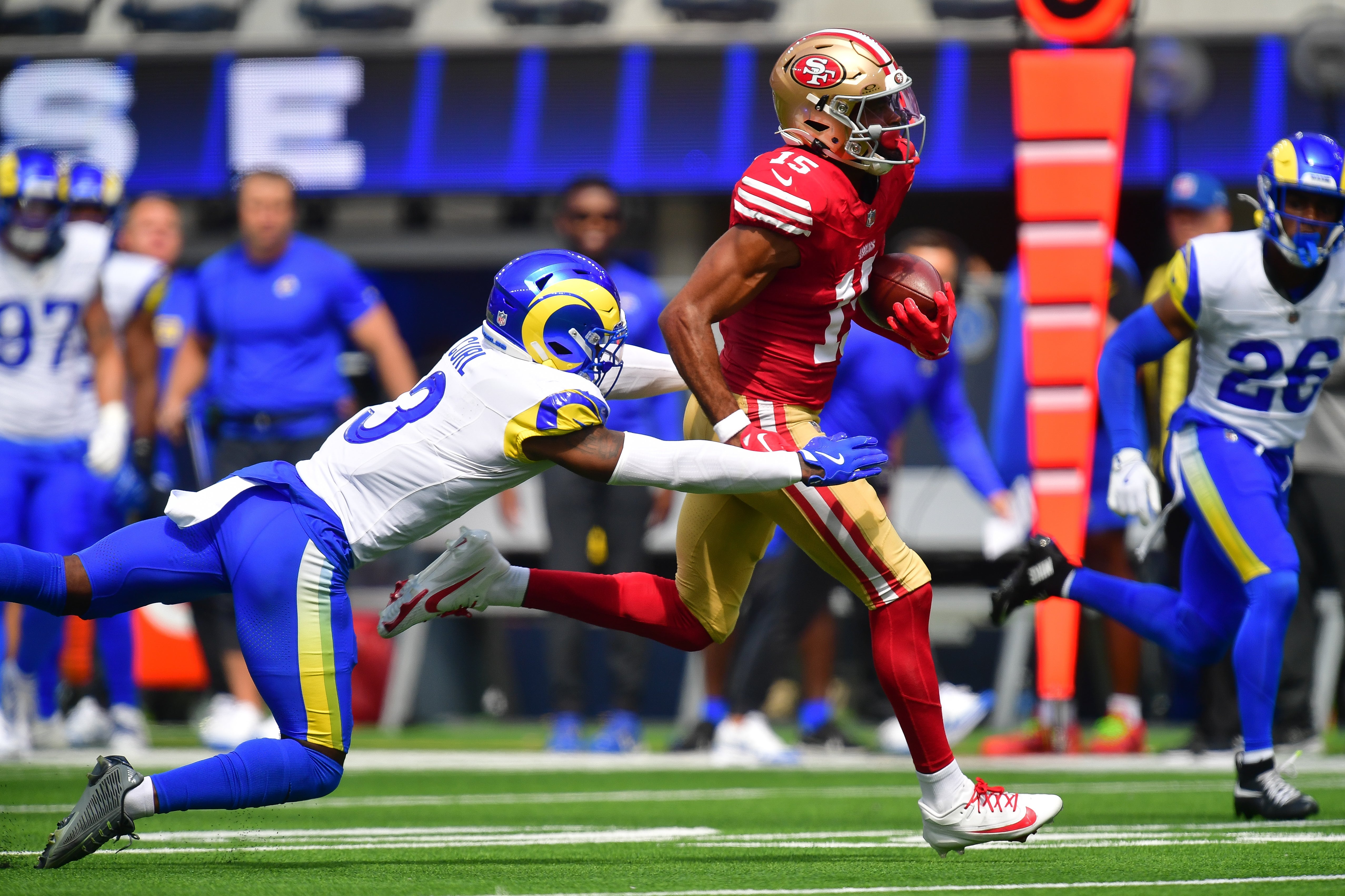 Sep 22, 2024; Inglewood, California, USA; San Francisco 49ers wide receiver Jauan Jennings (15) runs the ball against Los Angeles Rams safety Kamren Curl (3) during the first half at SoFi Stadium.