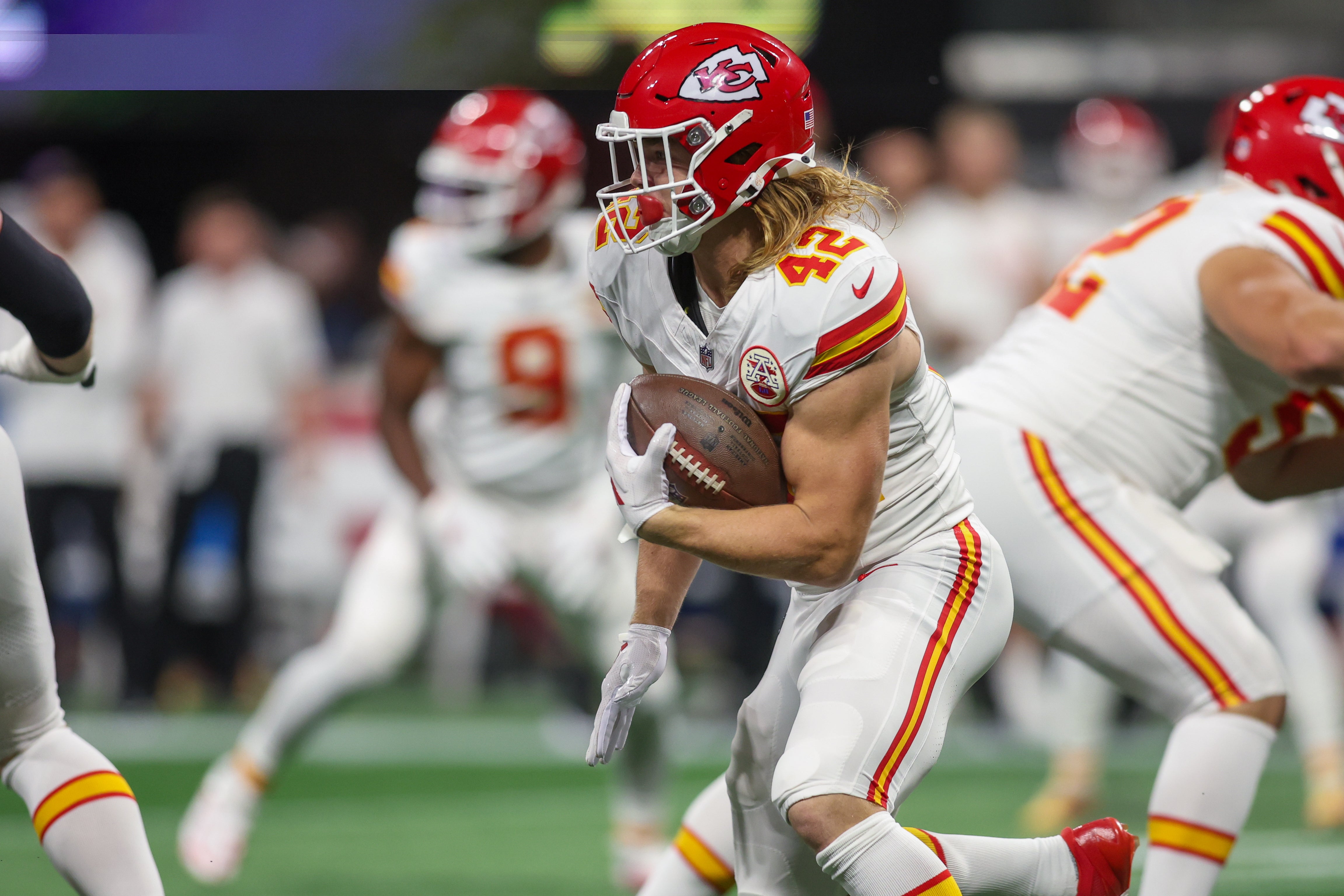 Sep 22, 2024; Atlanta, Georgia, USA; Kansas City Chiefs running back Samaje Perine (34) is tackled by Atlanta Falcons linebacker Troy Andersen (44) in the second quarter at Mercedes-Benz Stadium.