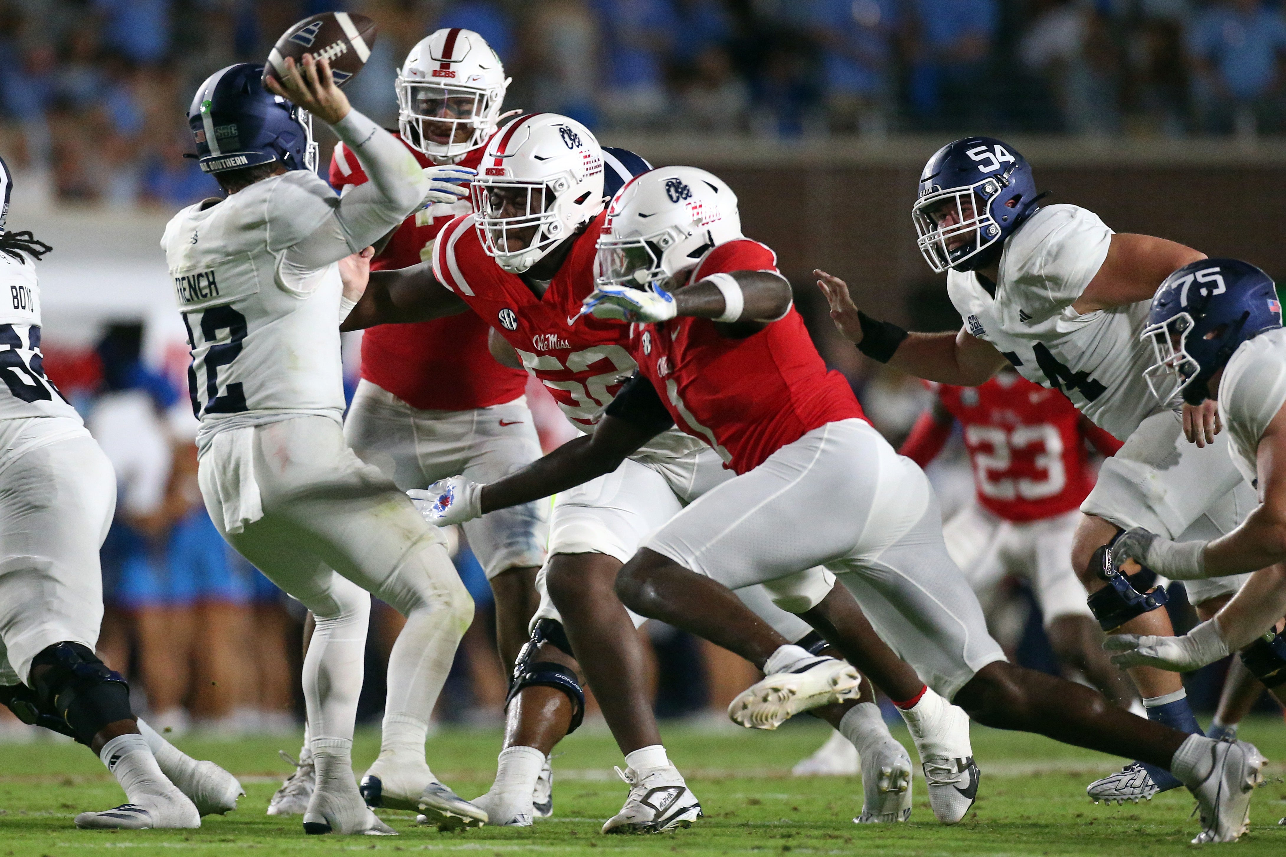 Sep 21, 2024; Oxford, Mississippi, USA; Mississippi Rebels defensive linemen William Echoles (52) and Princely Umanmielen (1) rush Georgia Southern Eagles quarterback JC French (12) as he throws during the first half at Vaught-Hemingway Stadium.