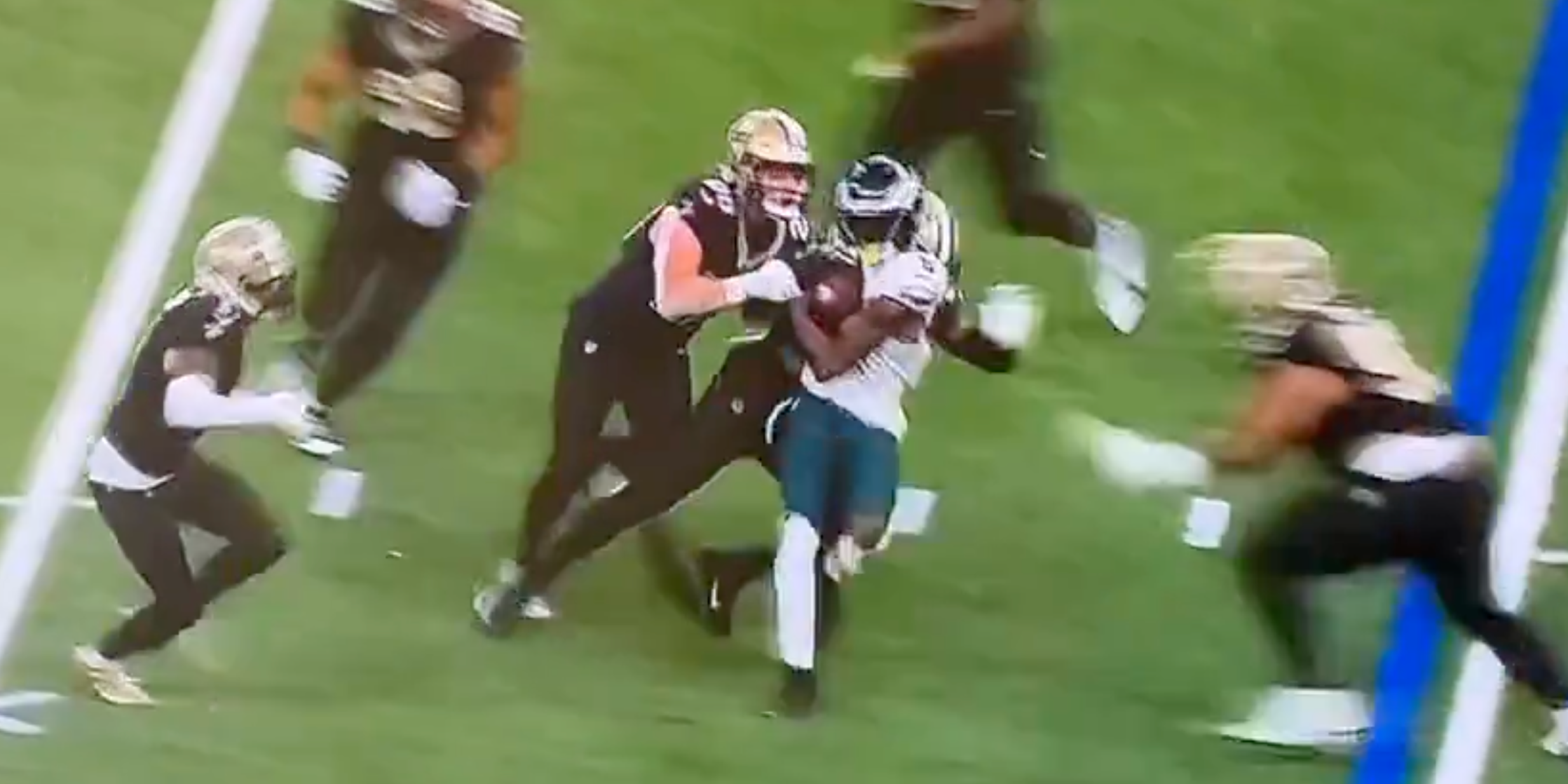 Eagles WR DeVonta Smith is tackled late by Saints DT Kristian Boyd