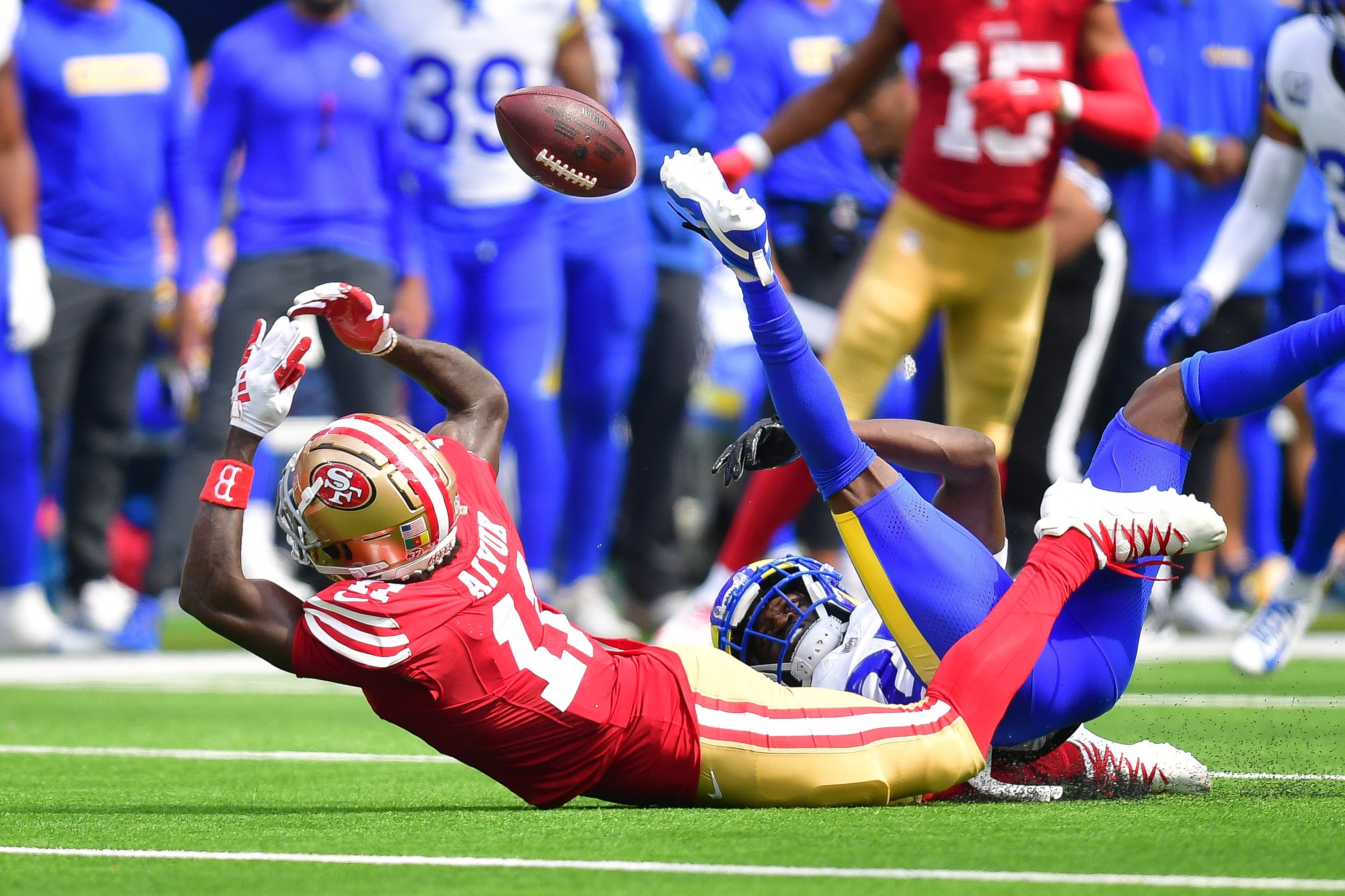 Sep 22, 2024; Inglewood, California, USA; San Francisco 49ers wide receiver Brandon Aiyuk (11) misses catching a pass against the defense of Los Angeles Rams cornerback Tre'Davious White (27) during the first half at SoFi Stadium.