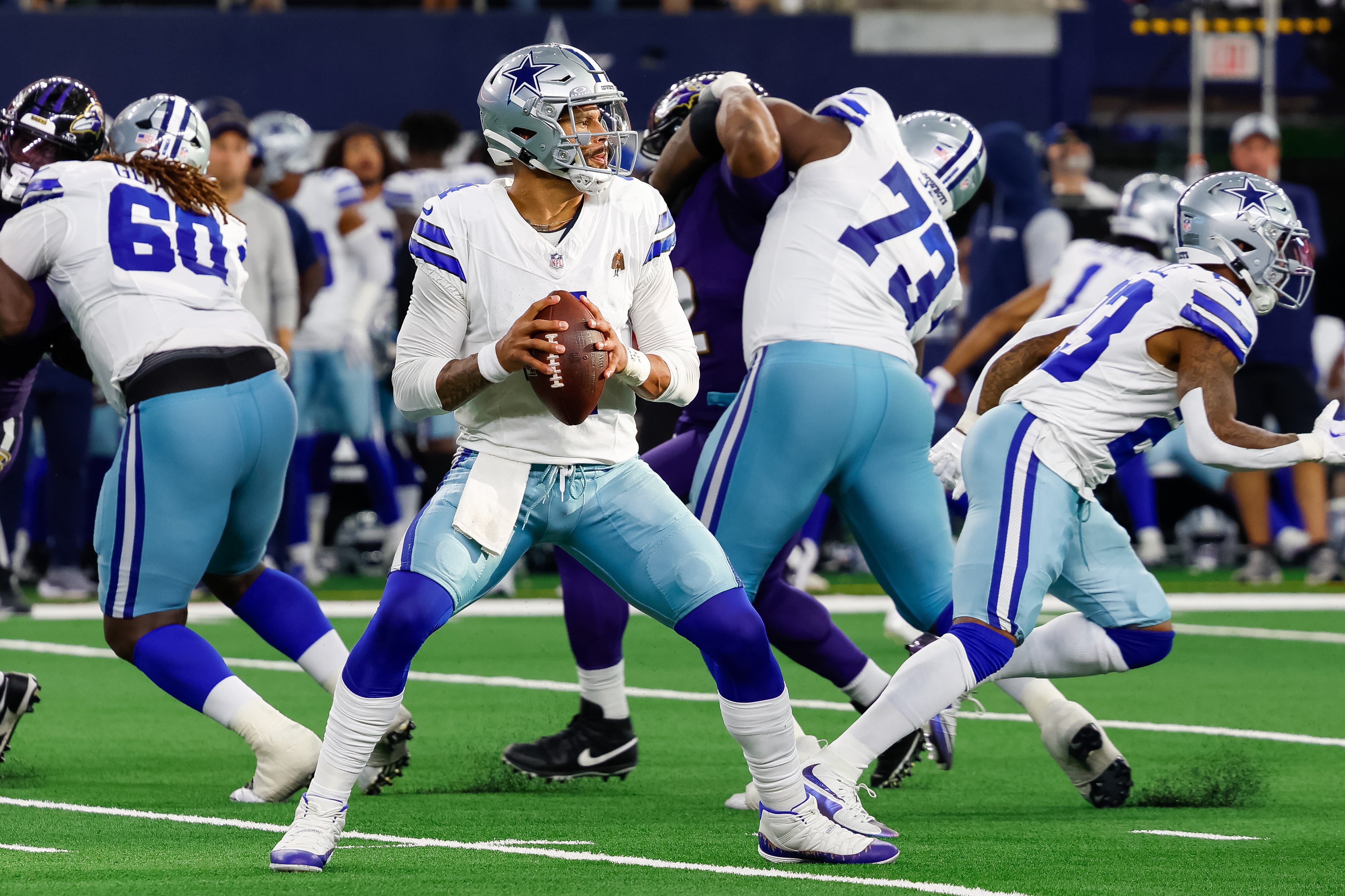 Dallas Cowboys quarterback Dak Prescott (4) drops back to pass fourth quarter against the Baltimore Ravens at AT&T Stadium.