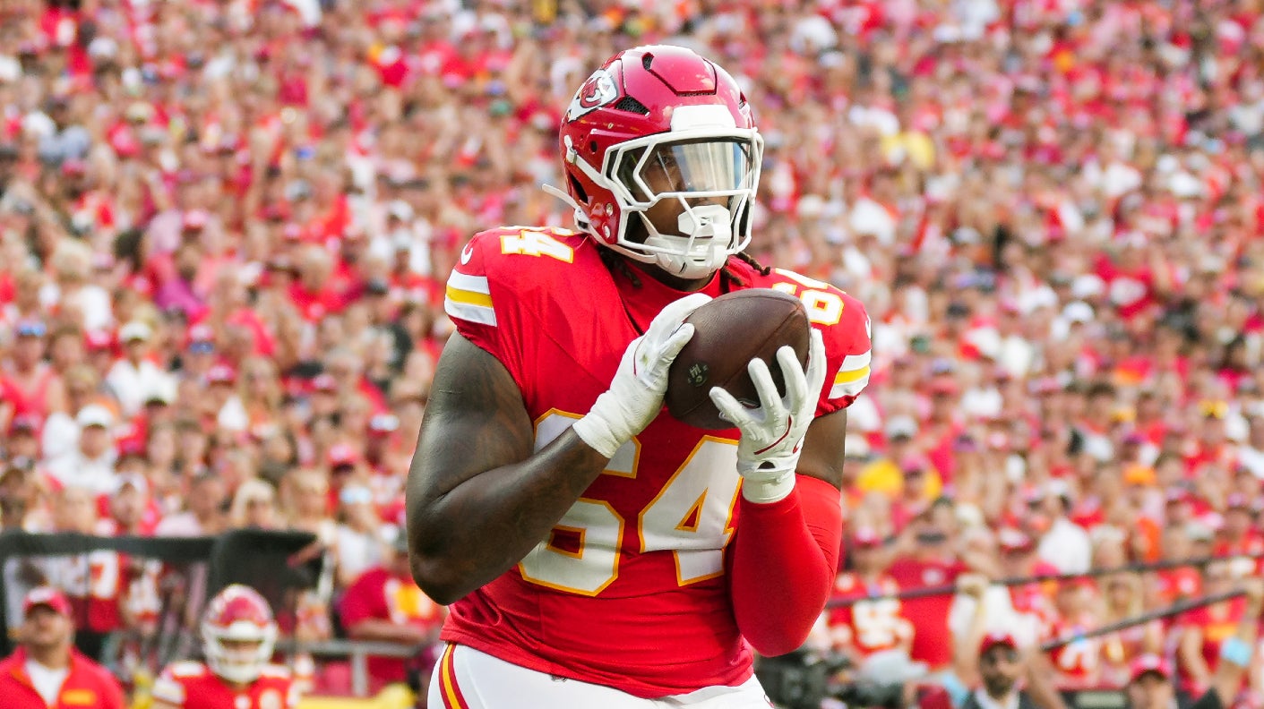 Sep 15, 2024; Kansas City, Missouri, USA; Kansas City Chiefs offensive tackle Wanya Morris (64) catches a touchdown pass during the second half against the Cincinnati Bengals at GEHA Field at Arrowhead Stadium.