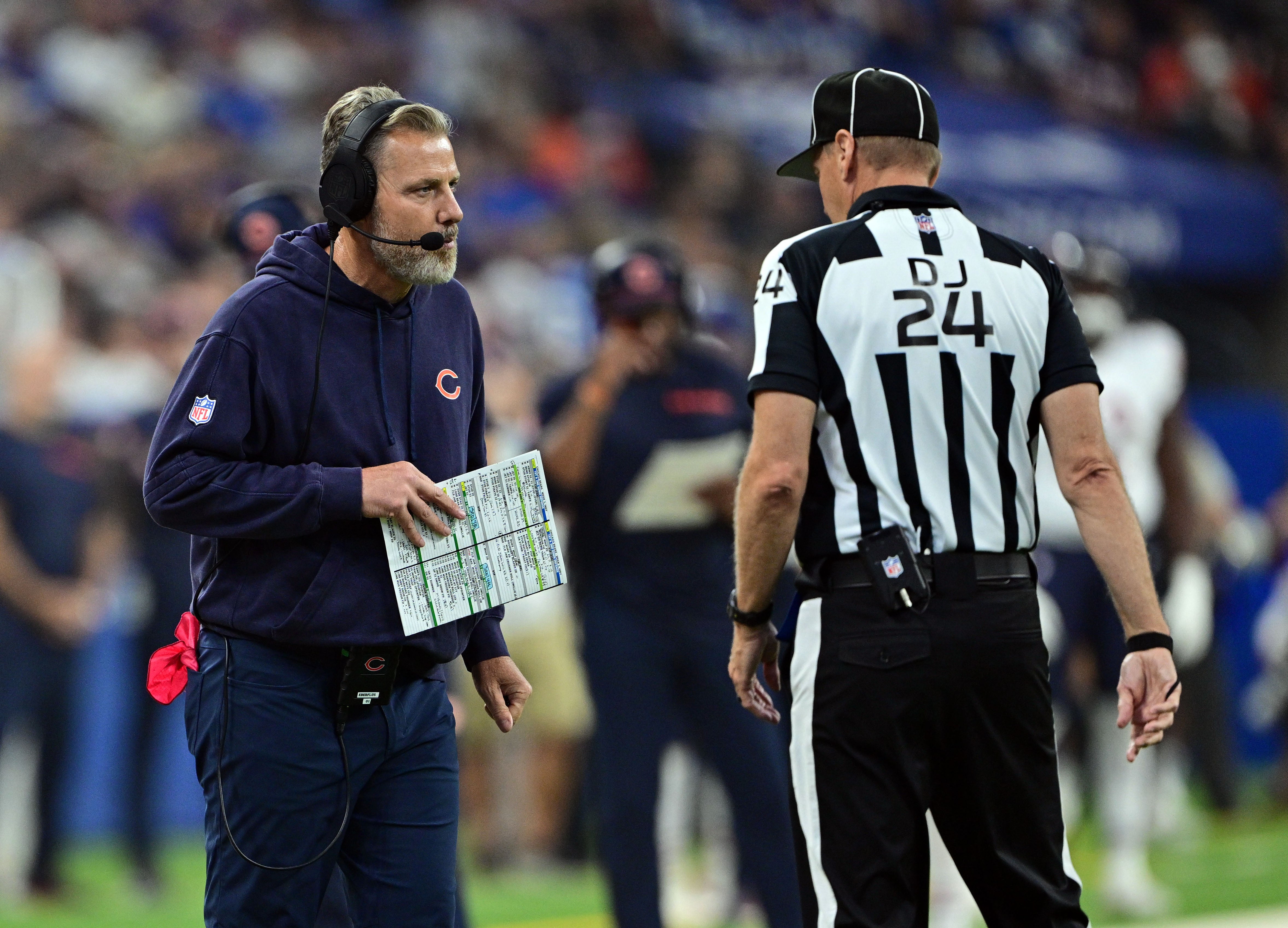 Sep 22, 2024; Indianapolis, Indiana, USA; Chicago Bears head coach Matt Eberflus has a moment with a referee during the first quarter against the Indianapolis Colts at Lucas Oil Stadium.