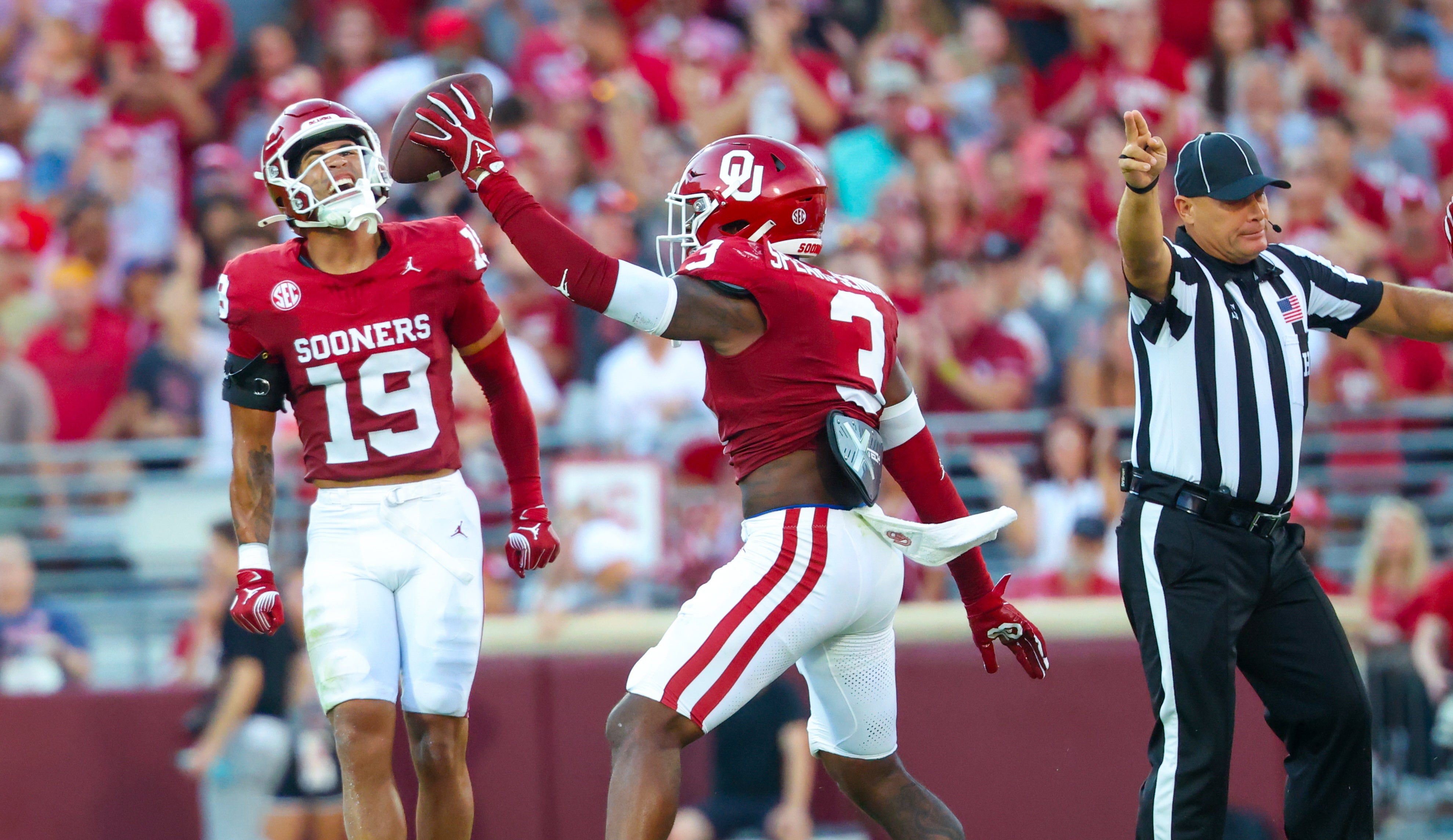 Oklahoma Sooners defensive back Robert Spears-Jennings (3) celebrates with Oklahoma Sooners defensive back Jacobe Johnson (19) after recovering a fumble during the second quarter against the Temple Owls at Gaylord Family-Oklahoma Memorial Stadium.