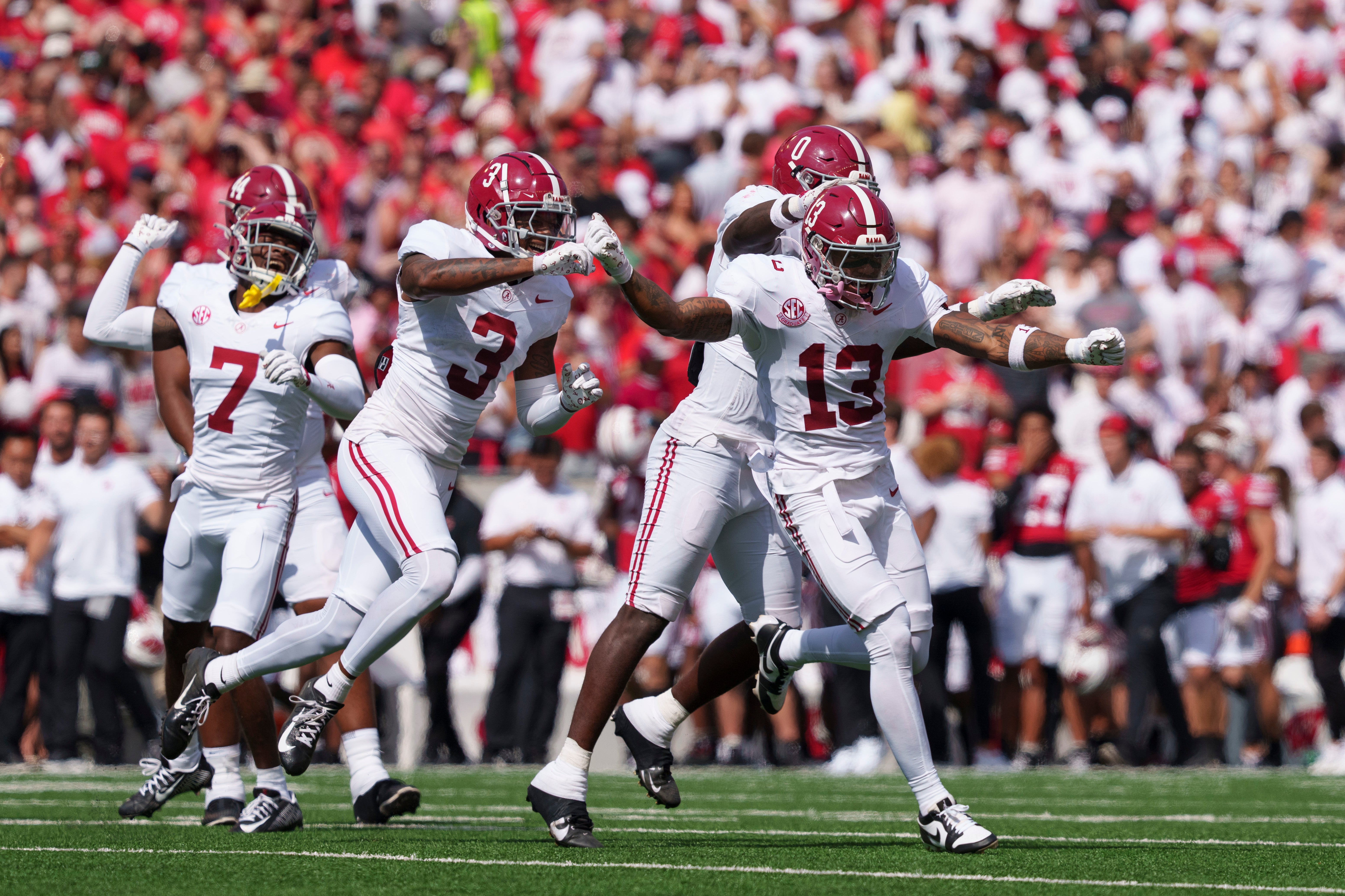 Sep 14, 2024; Madison, Wisconsin, USA; Alabama Crimson Tide defensive back Malachi Moore (13) celebrates following a Wisconsin Badgers fumble during the second quarter at Camp Randall Stadium. Mandatory Credit: Jeff Hanisch-Imagn Images