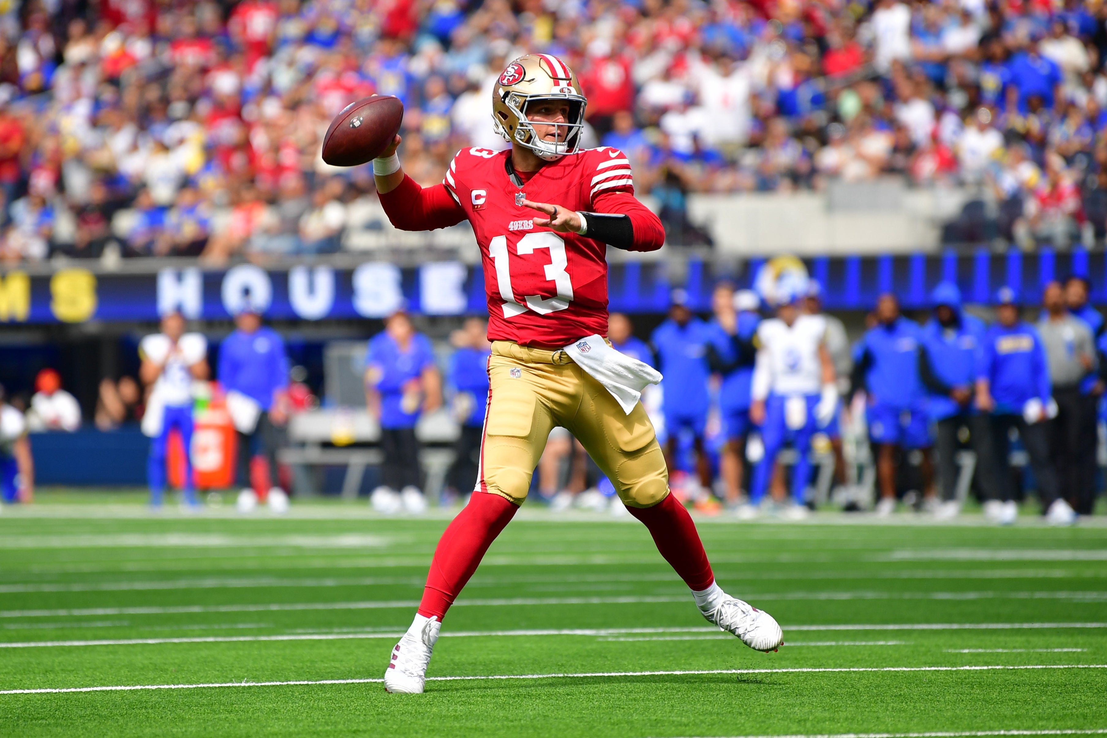 San Francisco 49ers quarterback Brock Purdy (13) throws a touchdown pass to wide receiver Jauan Jennings (15) against the Los Angeles Rams during the first half at SoFi Stadium.
